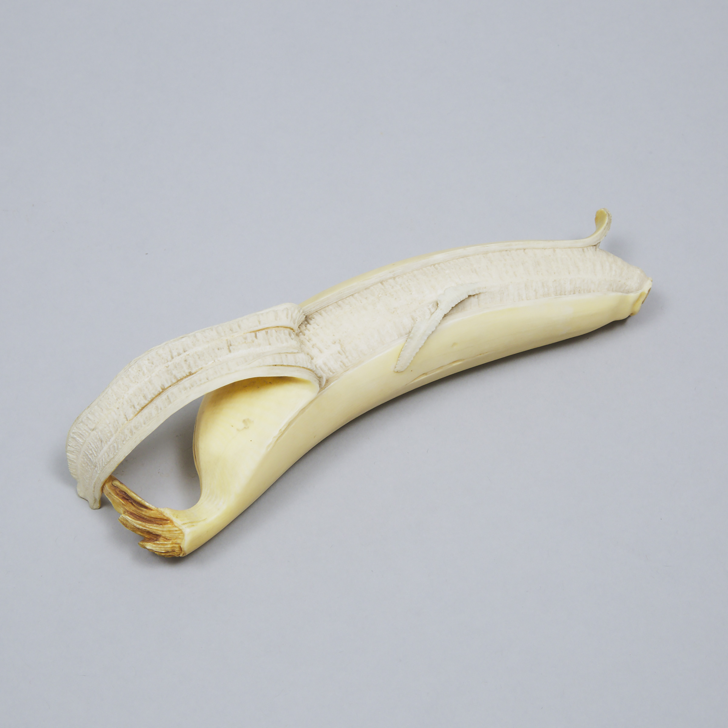 Japanese Carved and Stained Ivory Okimono Banana, Meiji Period, 19th/20th century