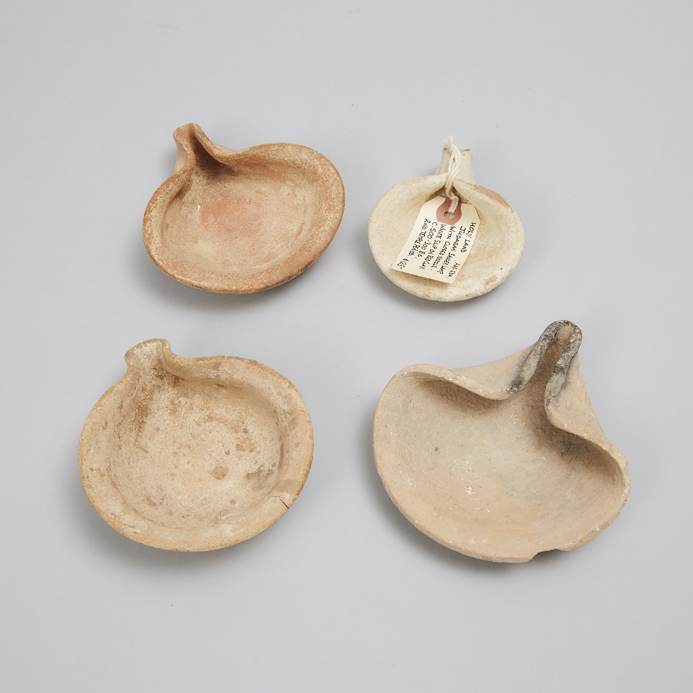 Four Levantine-Holy Land Pottery Pinched Saucer Oil Lamps, Iron Age, 1200-300 B.C.