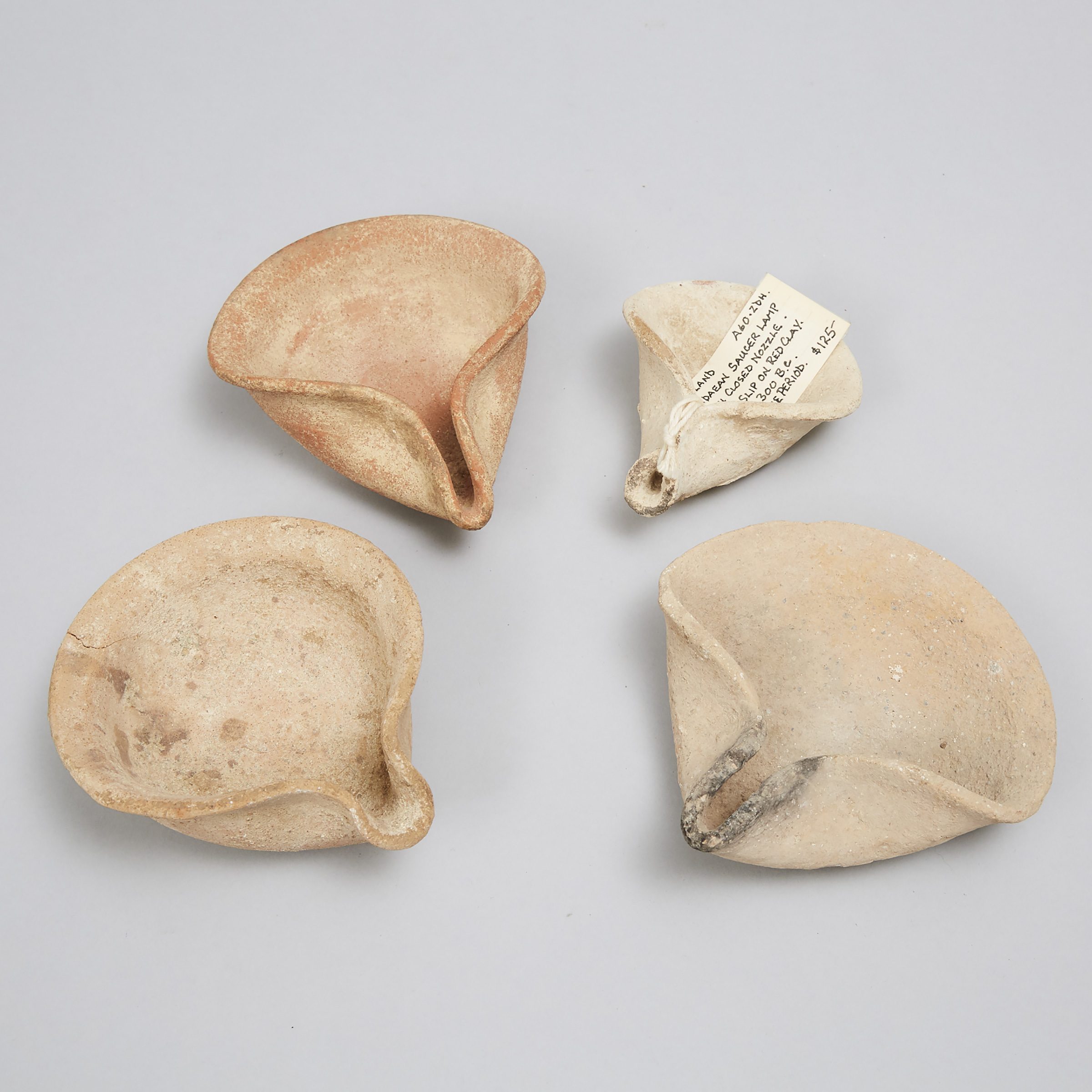 Four Levantine-Holy Land Pottery Pinched Saucer Oil Lamps, Iron Age, 1200-300 B.C.