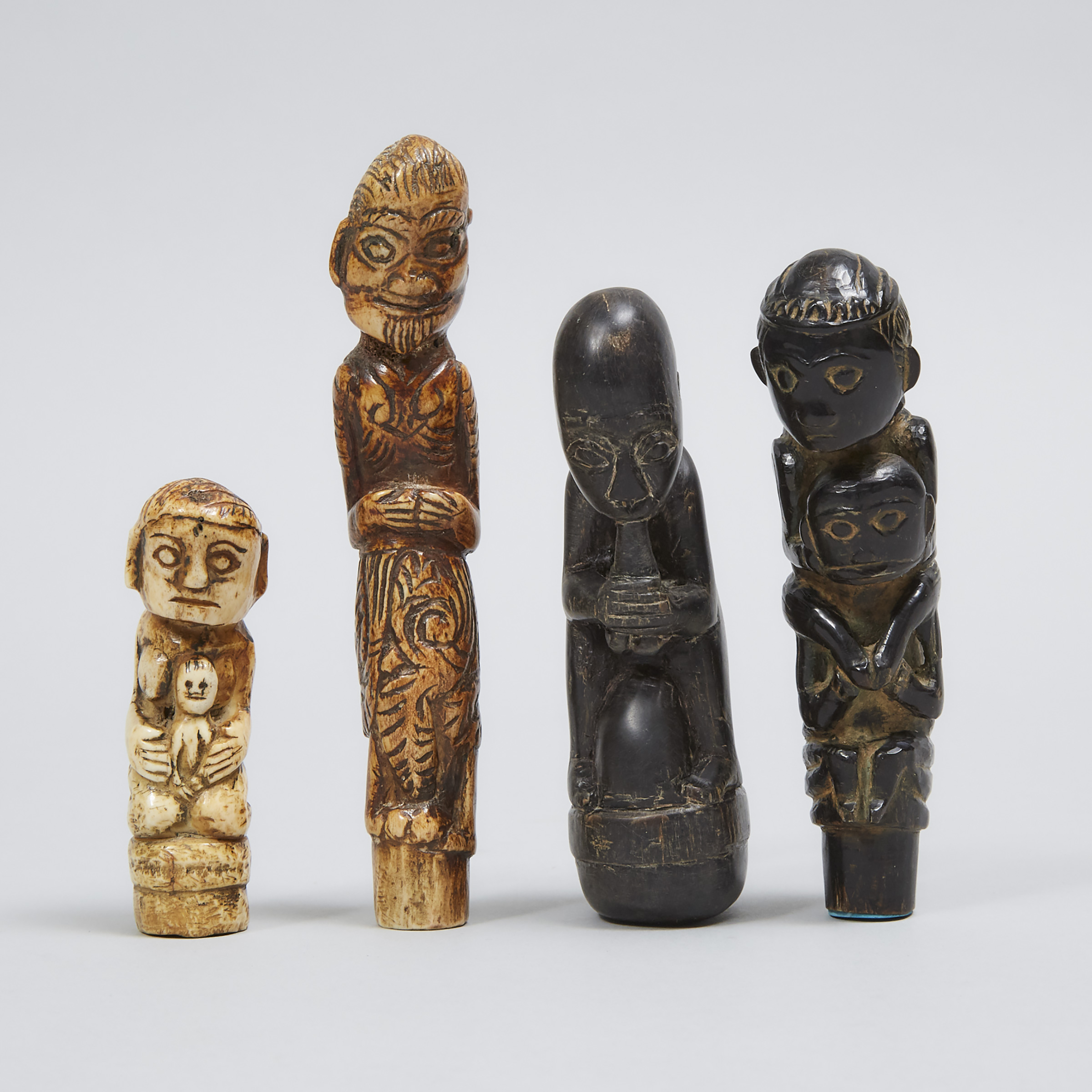 Four Indonesian Carved Bone and Horn Figural Betel Nut Crusher Handles, 19th/20 centuries