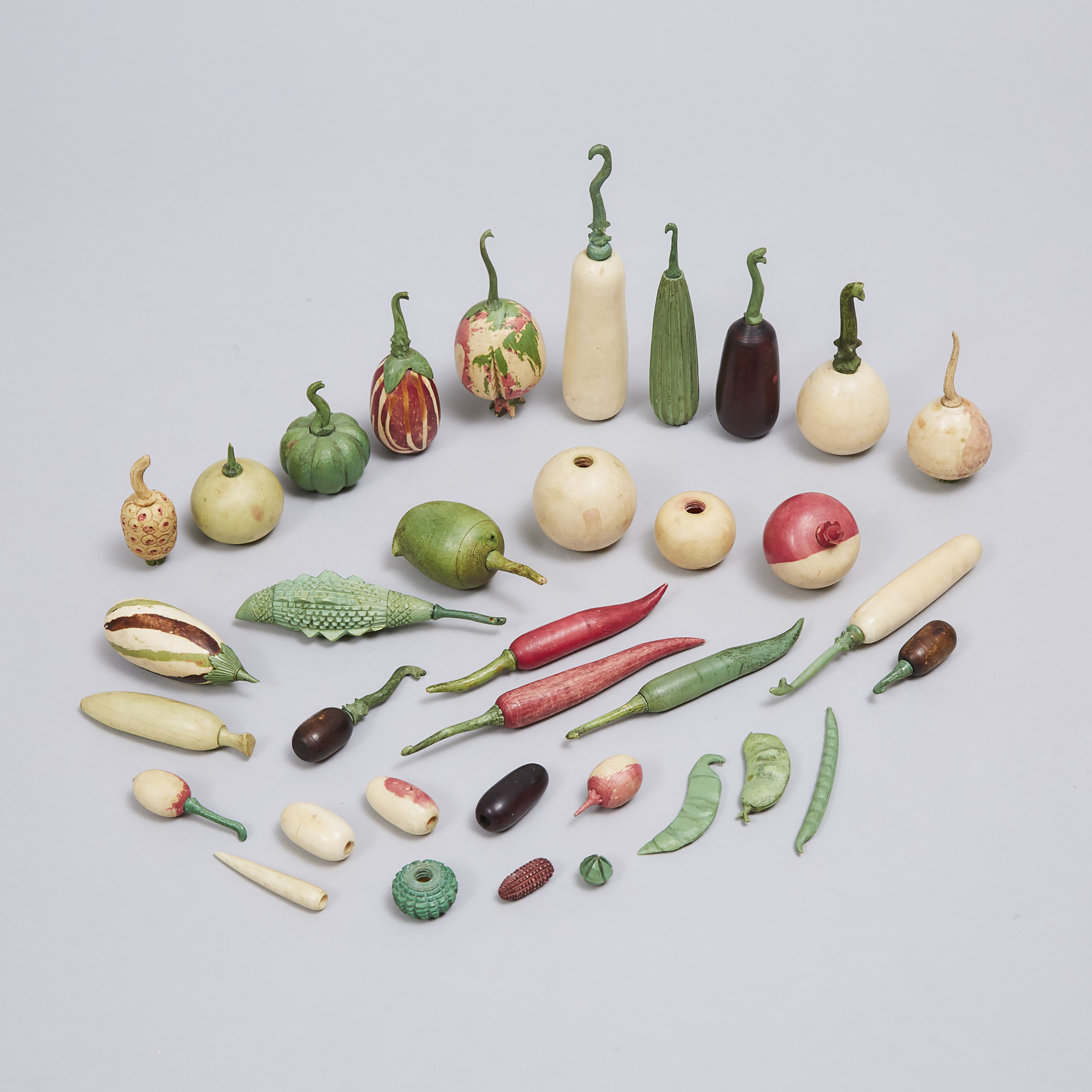 Collection of 32 Indian Carved and Stained Ivory Didactic Botanical Models of Fruit, Vegetables and Spice Nuts, 19th century