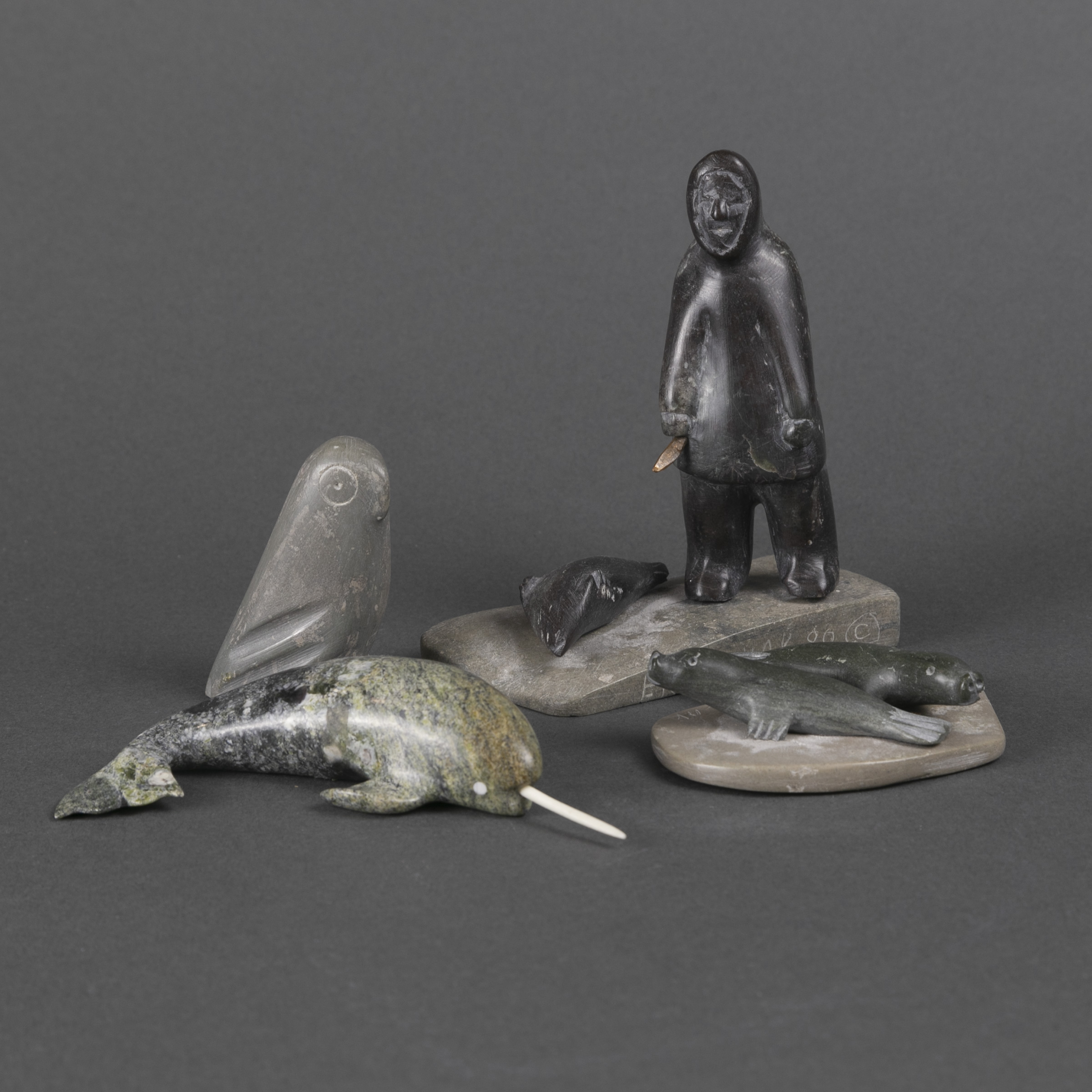 GROUP OF FOUR SMALLER SCULPTURES