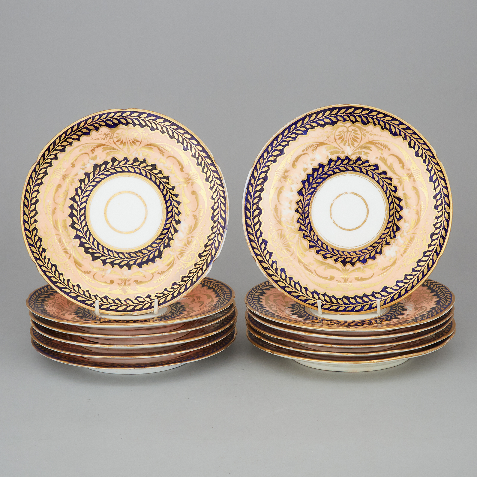 Twelve Coalport Apricot, Cobalt and Gilt Decorated Plates, early 19th century