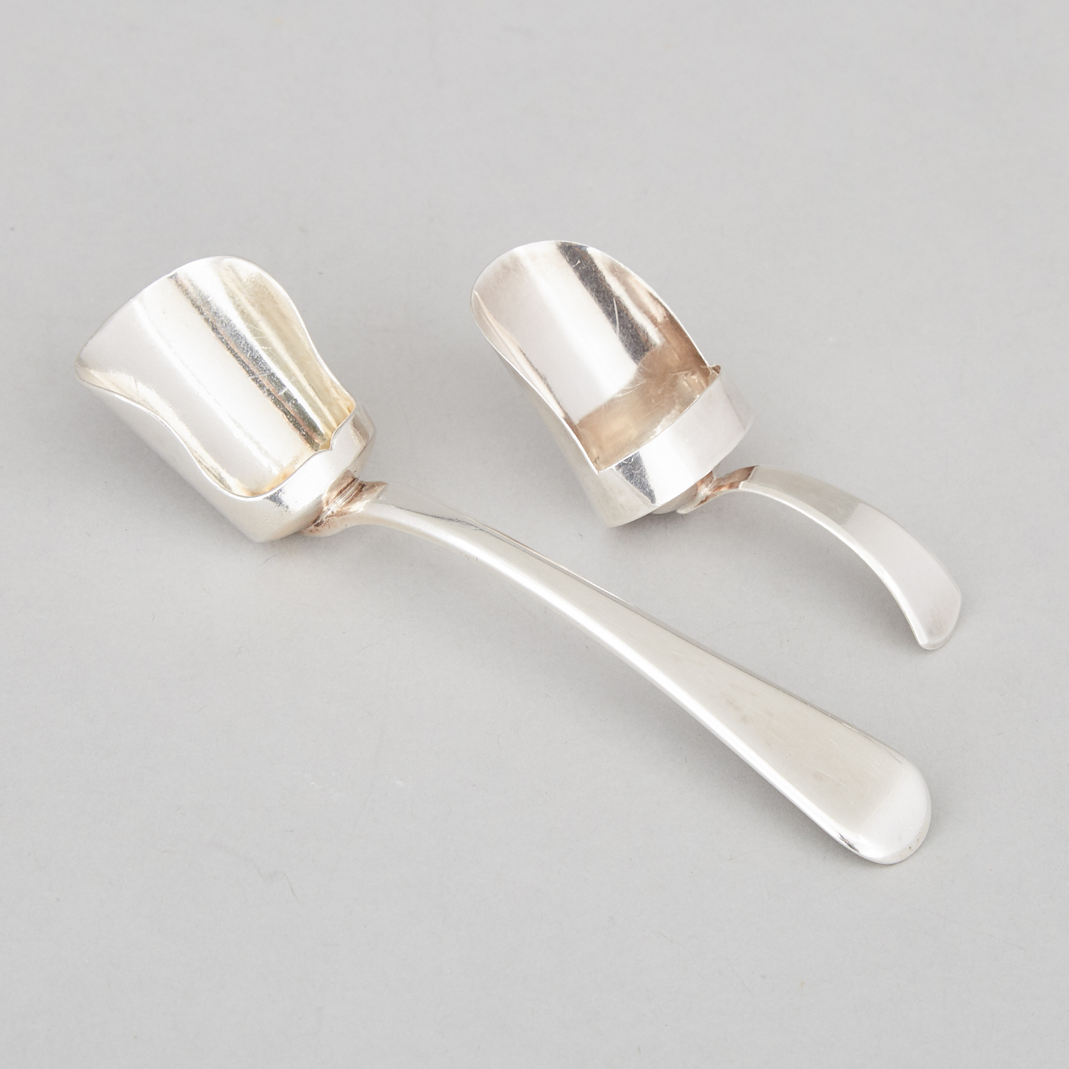 Two George III Silver Scoop Shaped Caddy Spoons, Josiah Snatt and William Eley & William Fearn, London, 1807/15