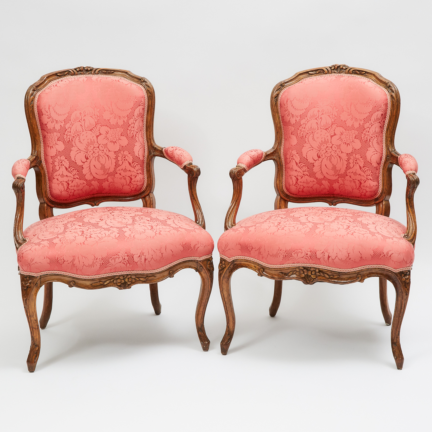 Pair of French Provincial Carved Walnut Fauteuils, 19th/early 20th century