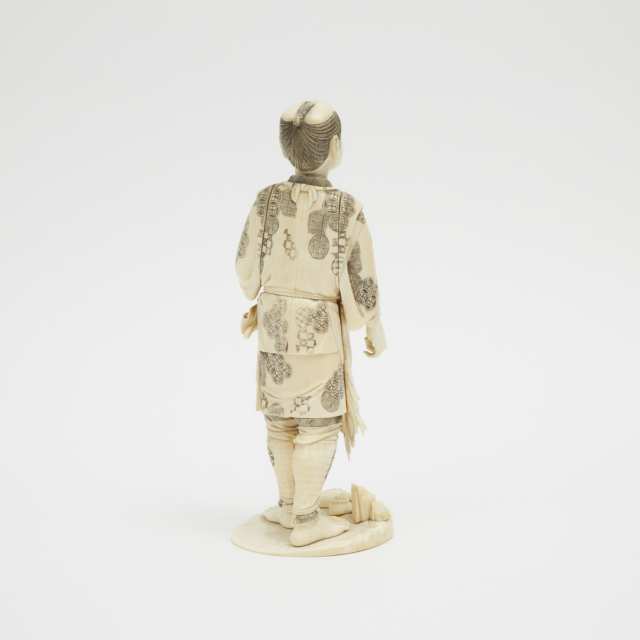 A Japanese Ivory Carved Figure of Fisherman