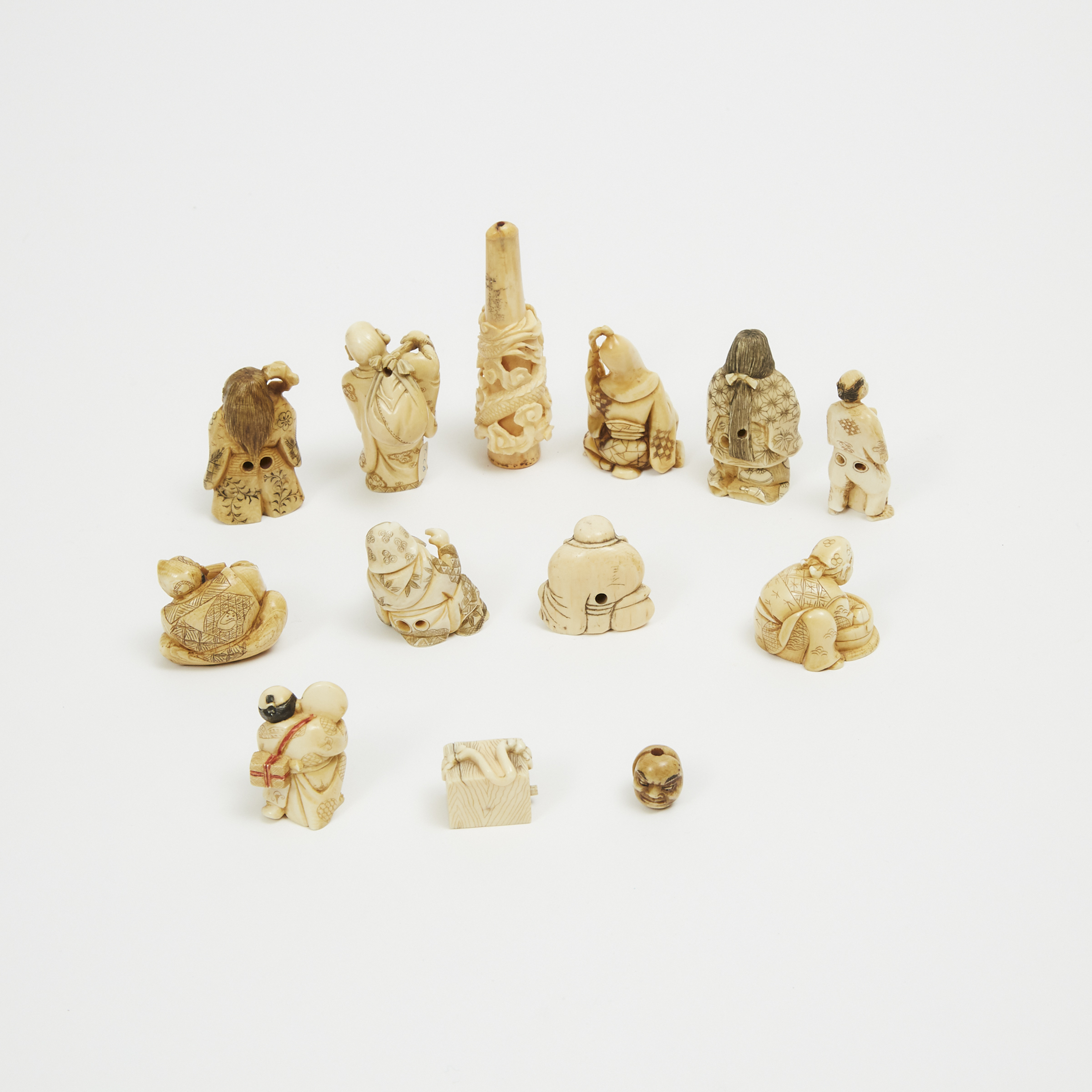 A Group of Thirteen Small Japanese Ivory Carvings