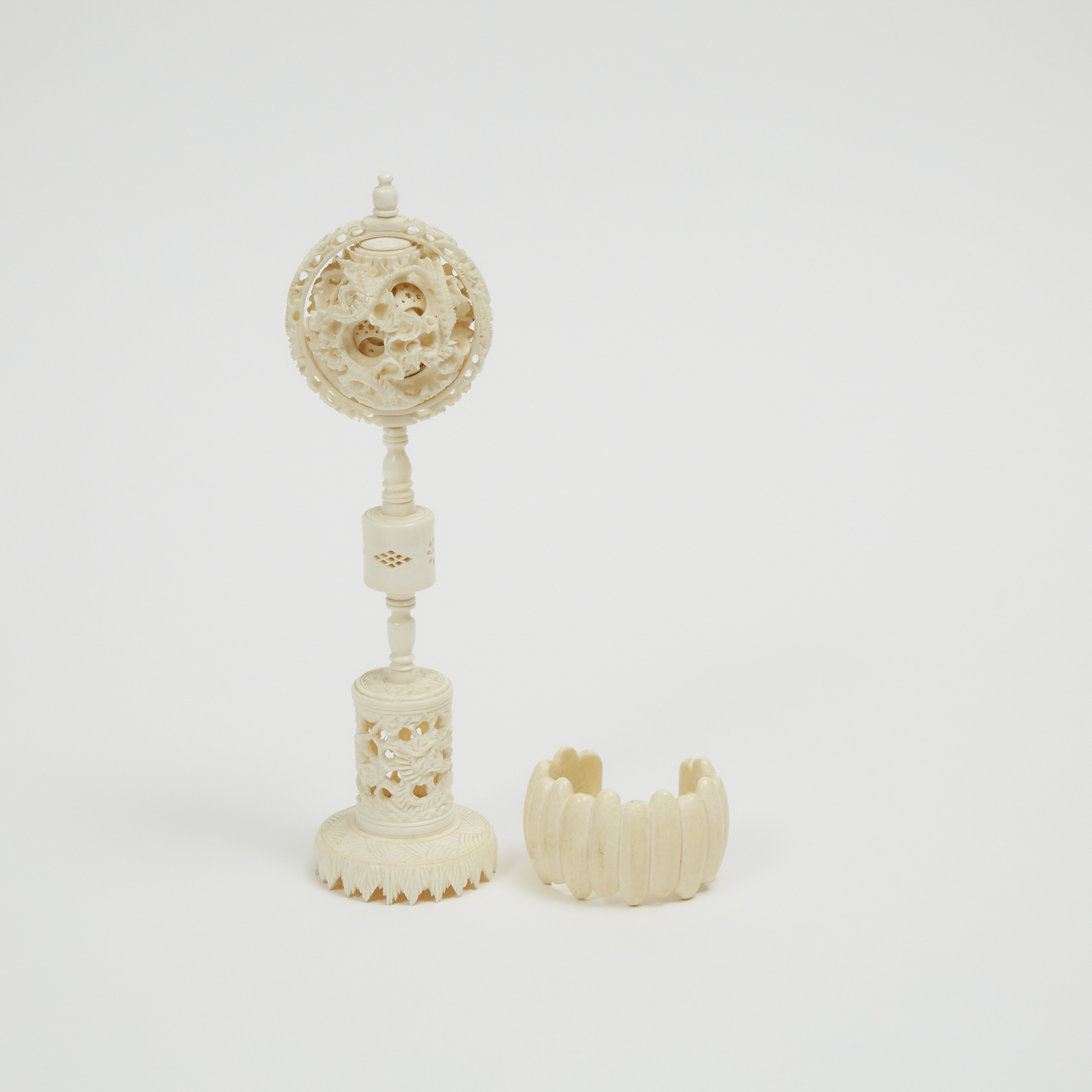 An Ivory Puzzle Ball and Bracelet