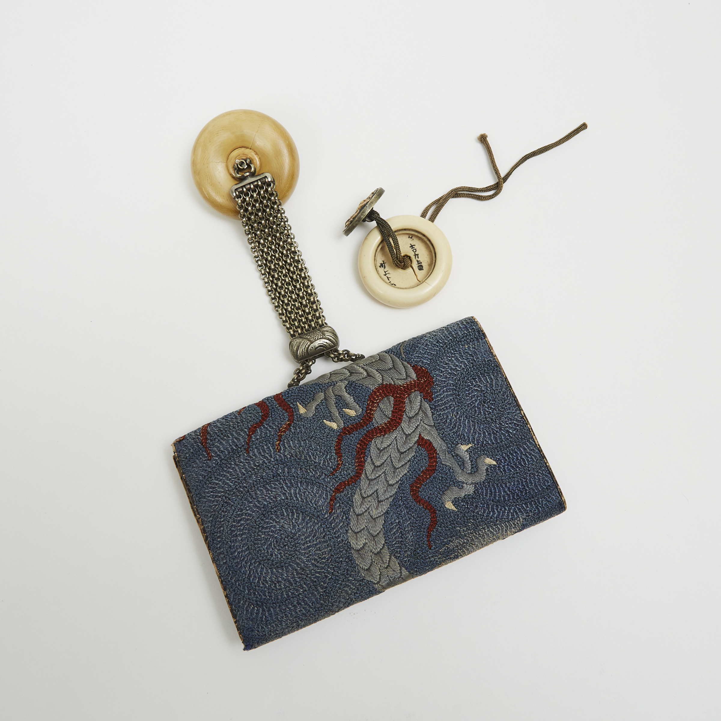A Silk Embroidered 'Dragon' Sagemono Tobacco Pouch with Matching Kagamibuta Netsuke, Meiji Period