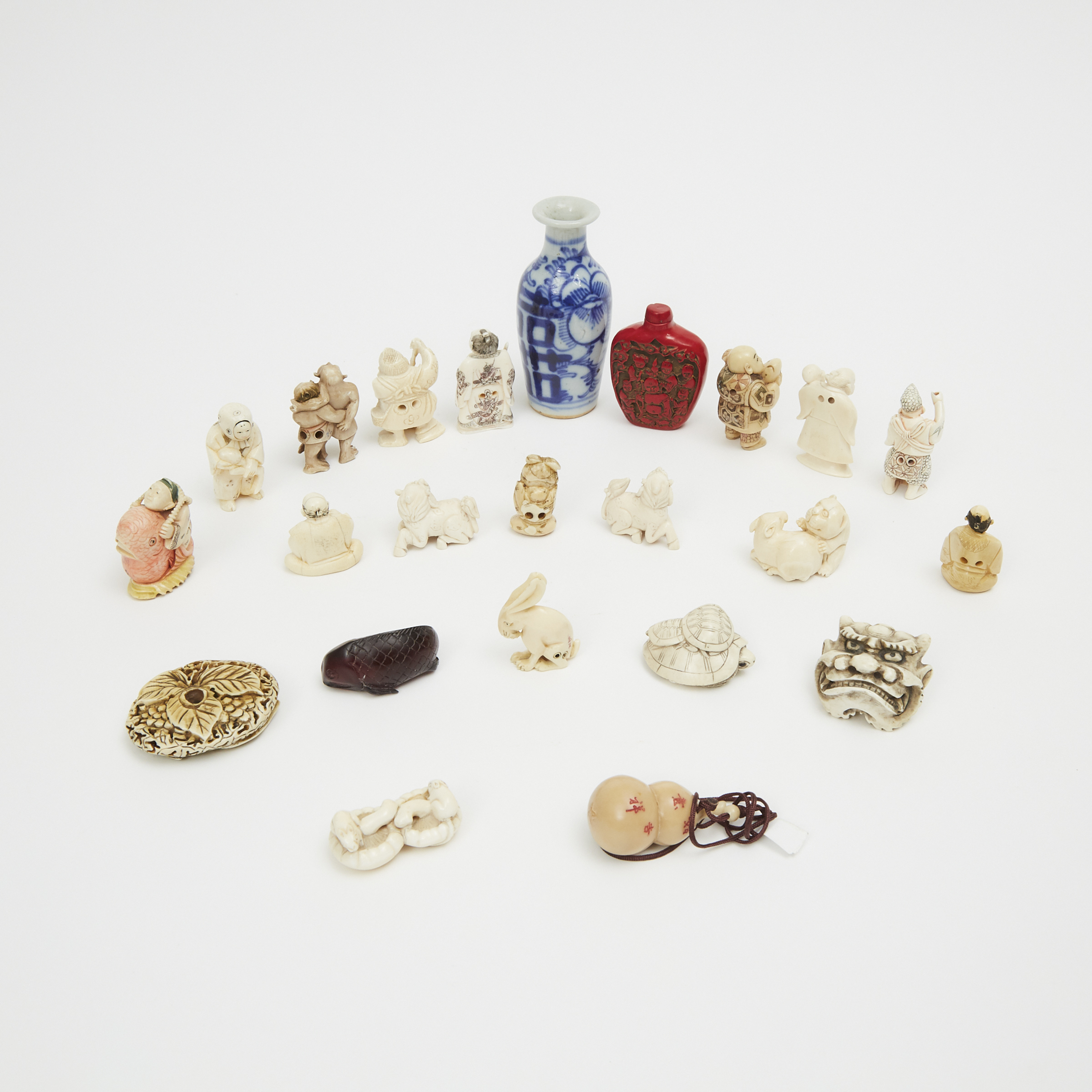 A Group of Twenty-Three Small Ivory, Ivorine, Wood and Ceramic Japanese and Chinese Items