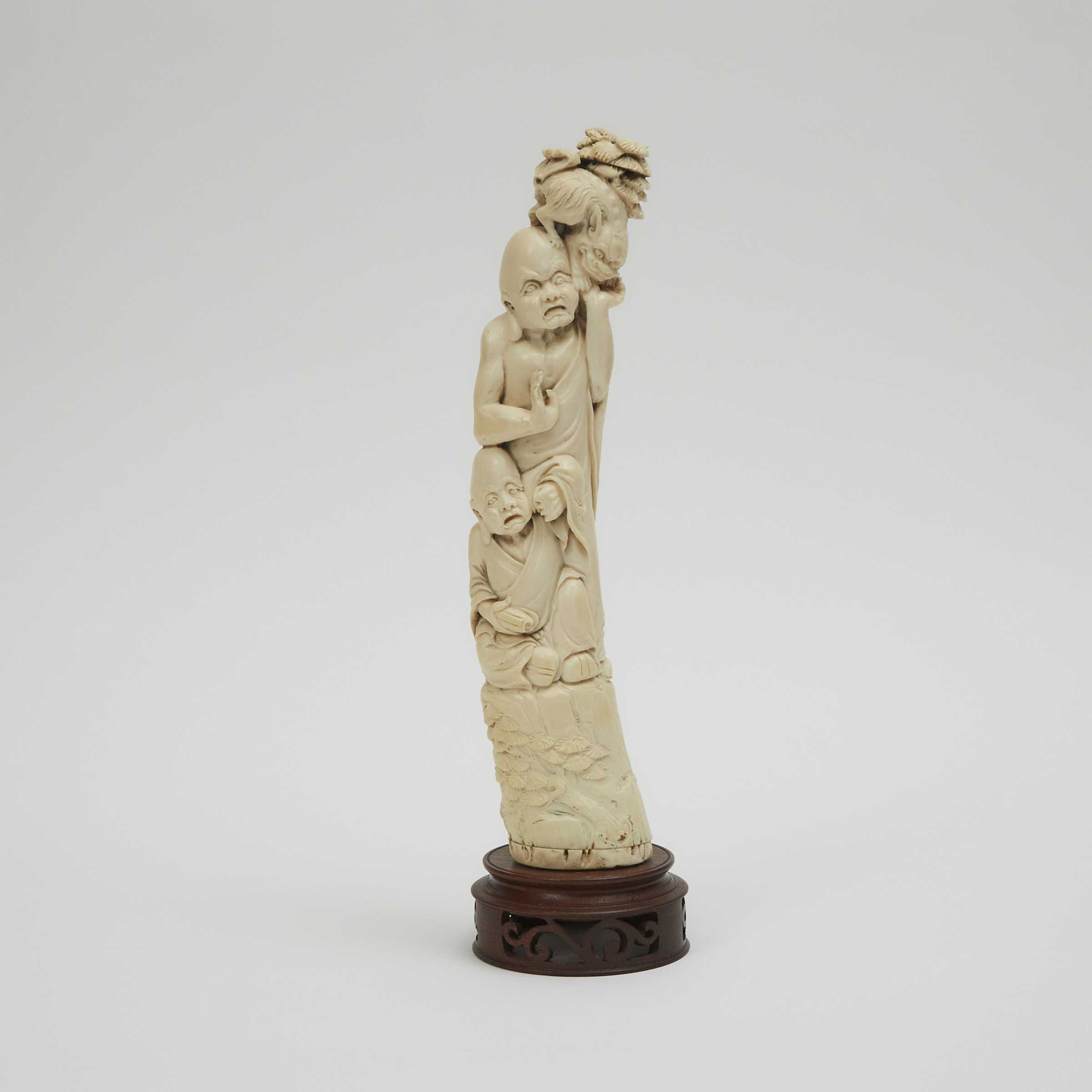 An Ivory Tusk Form Carving of Two Monks and a Shishi