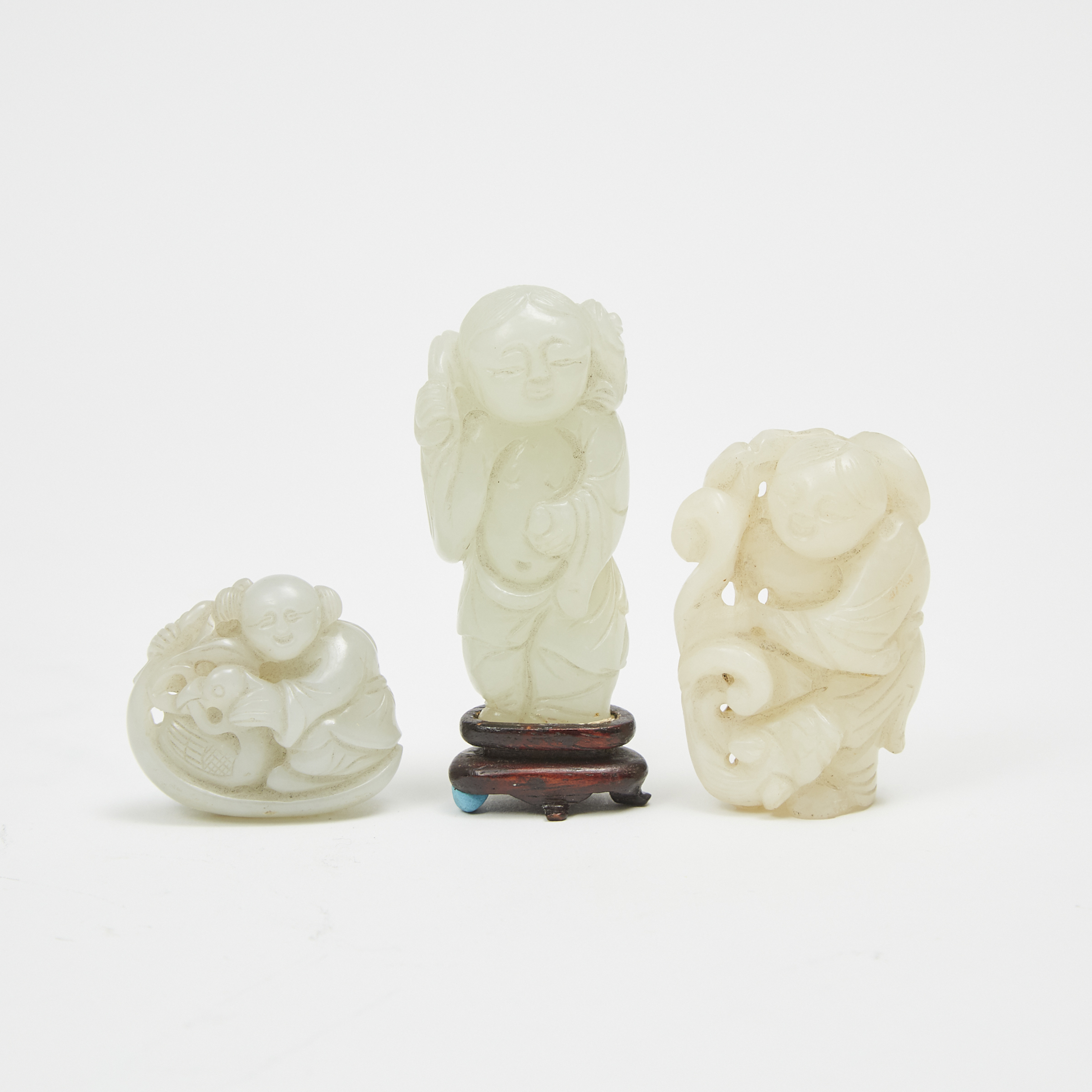 A Group of Three Jade Carved Boys