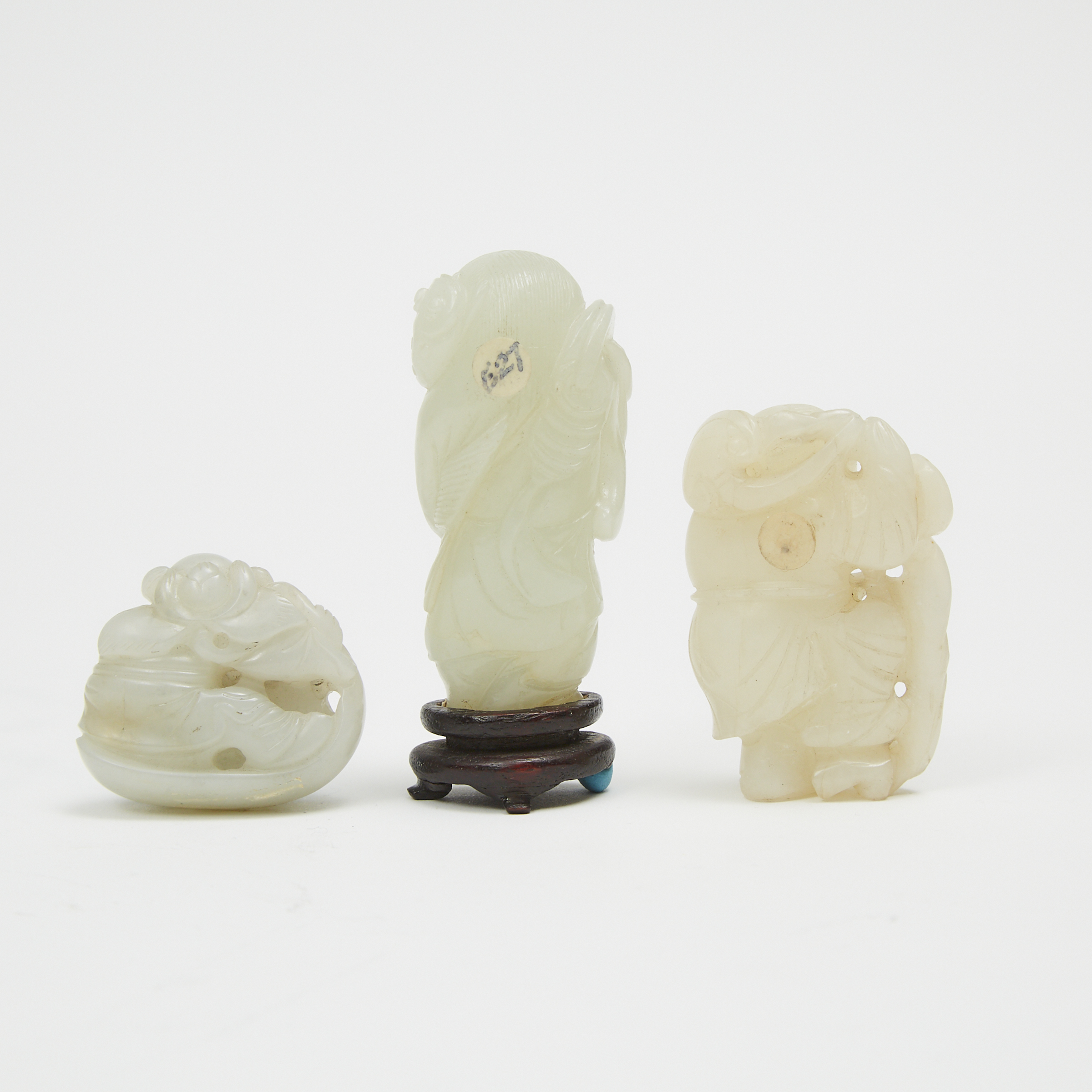 A Group of Three Jade Carved Boys