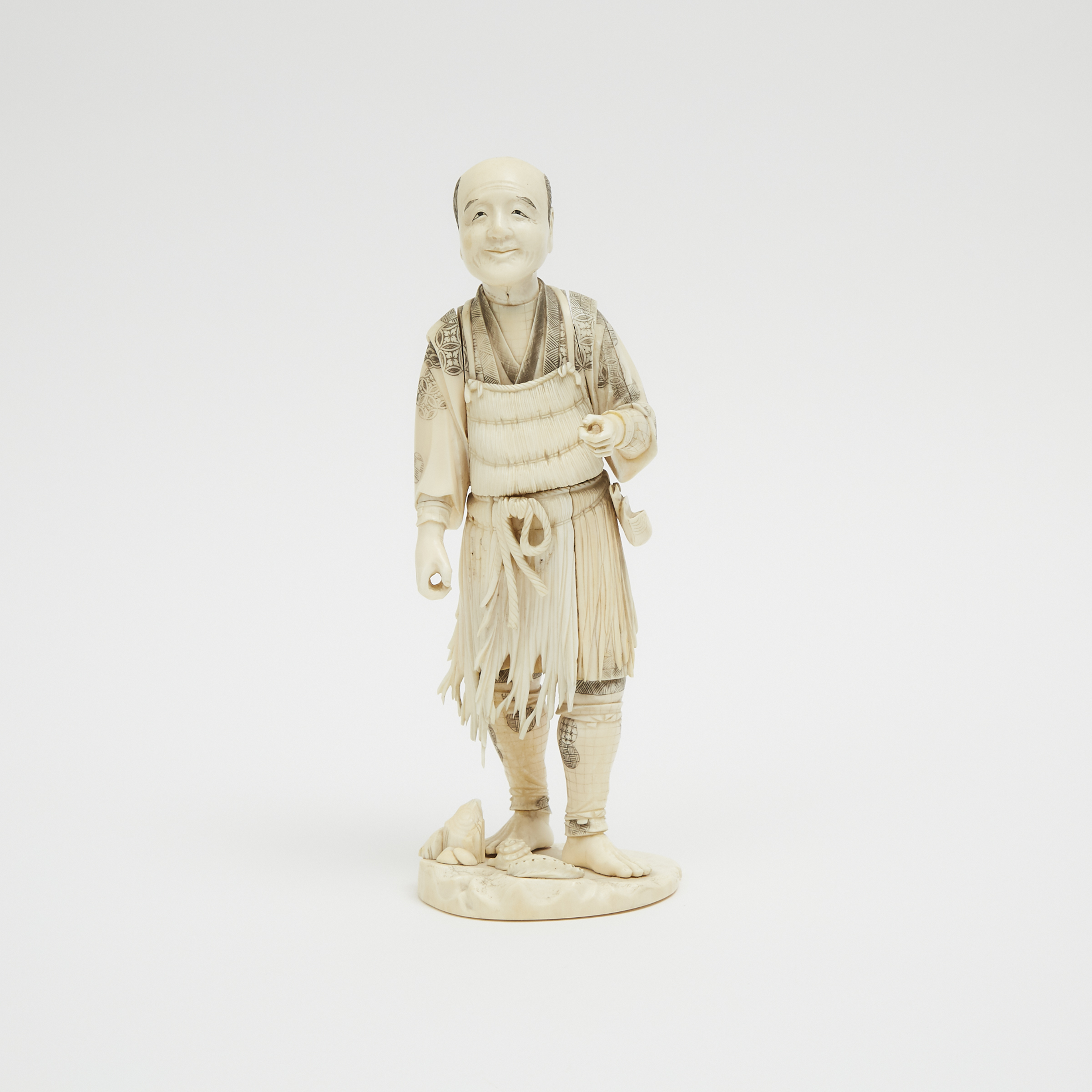 A Japanese Ivory Carved Figure of Fisherman