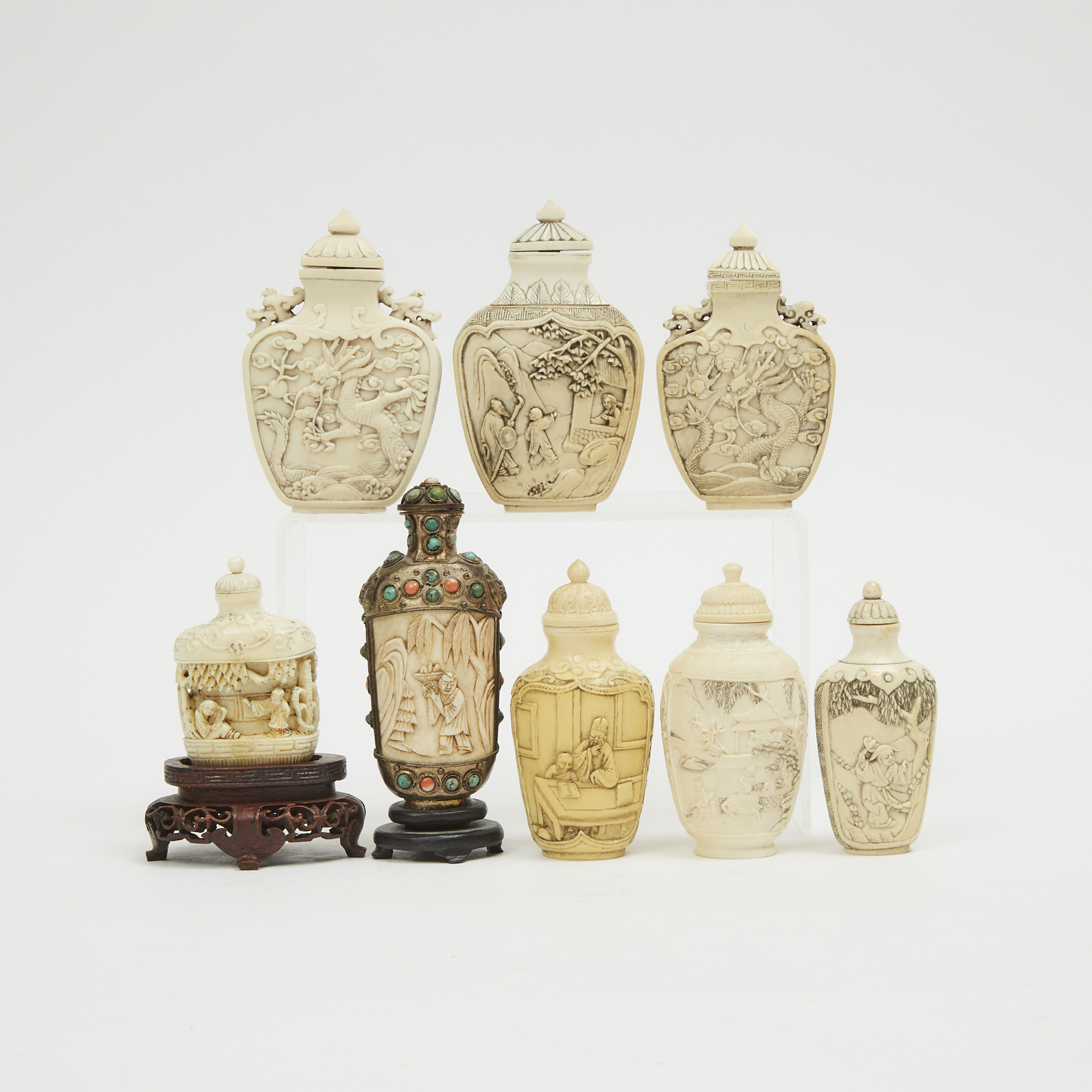A Group of Eight Ivory and Bone Carved Snuff Bottles