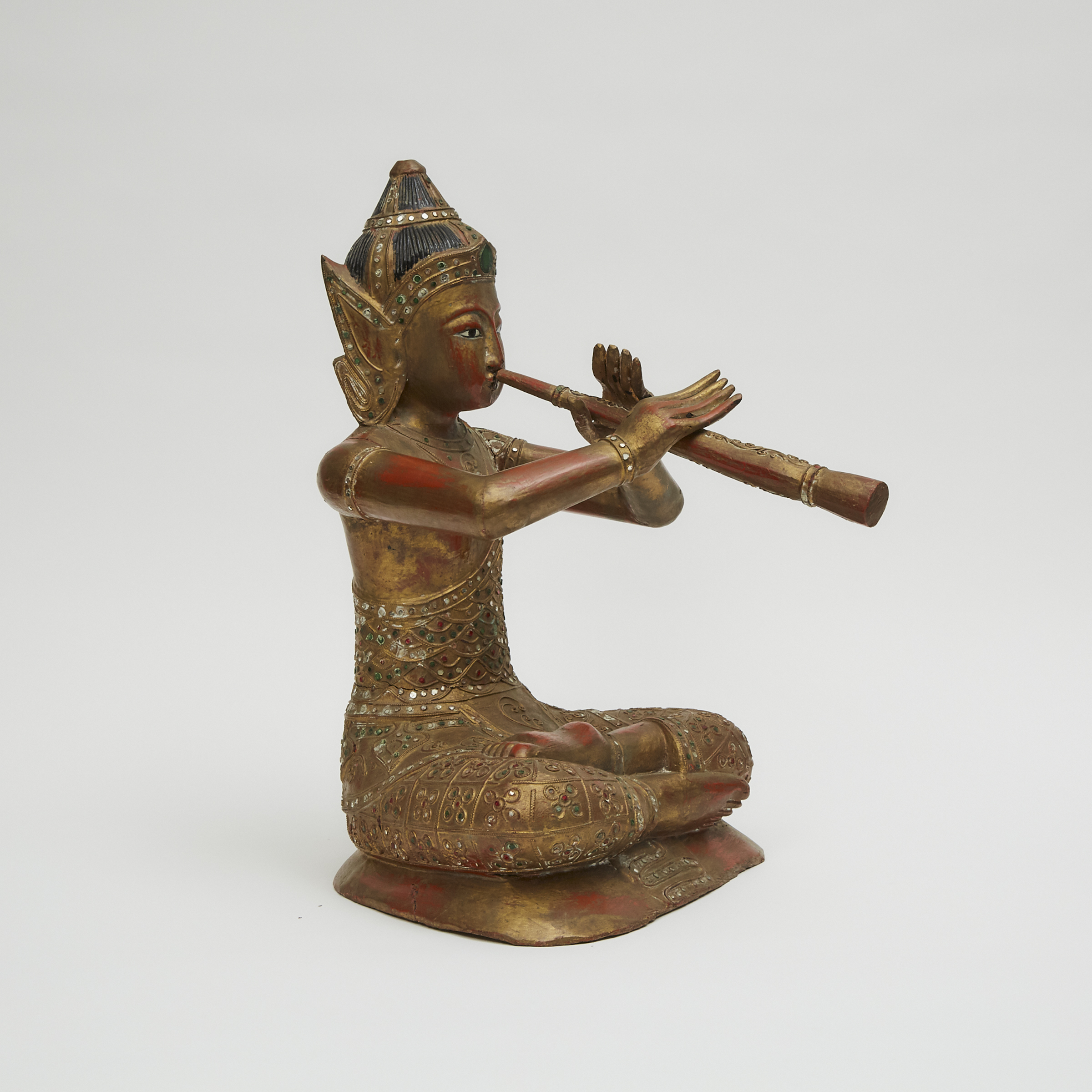 A Thai Lacquer Wood Figure of a Musician