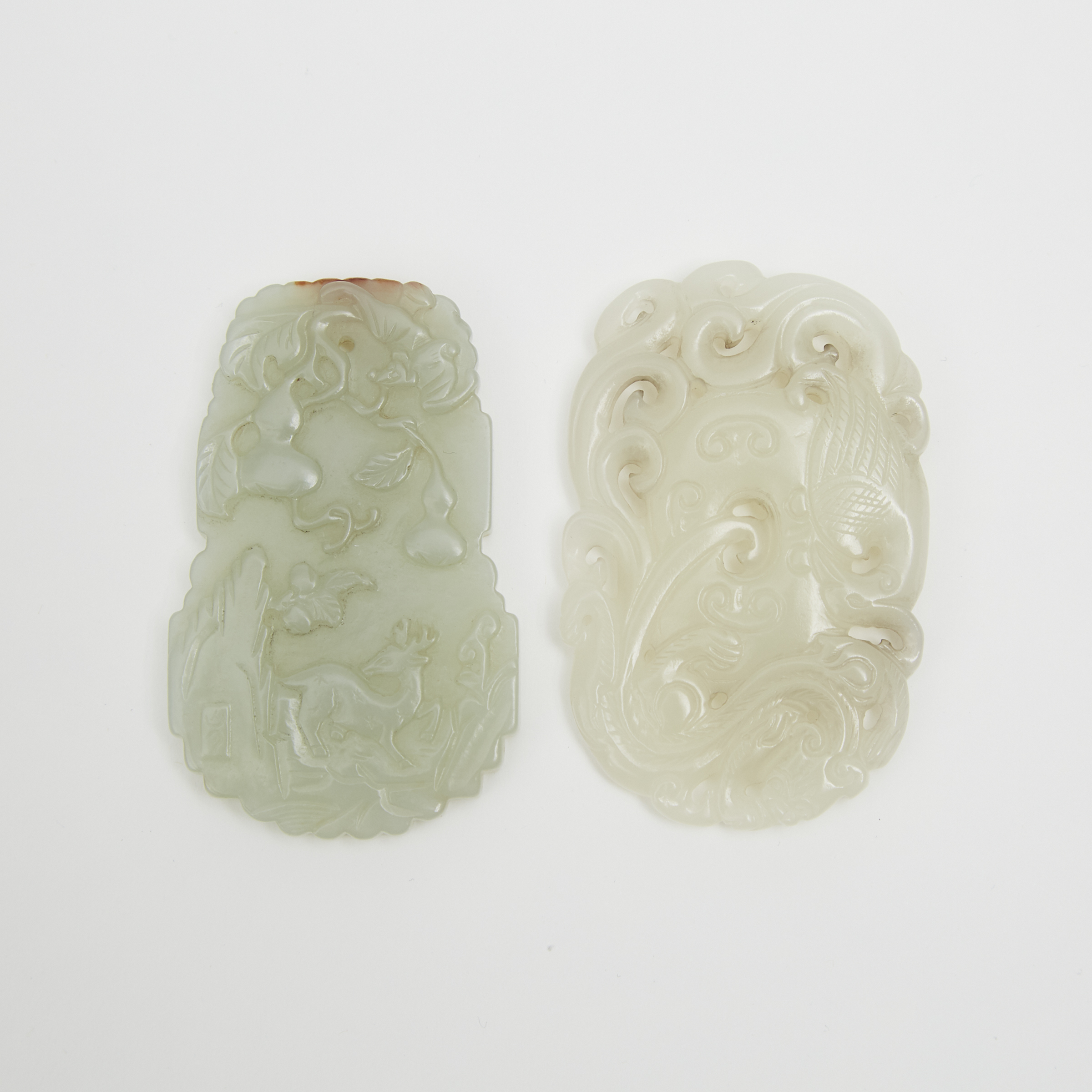 A White Jade 'Dragon and Egret' Plaque and a Pale Celadon Jade 'Deer and Gourd' Pendant