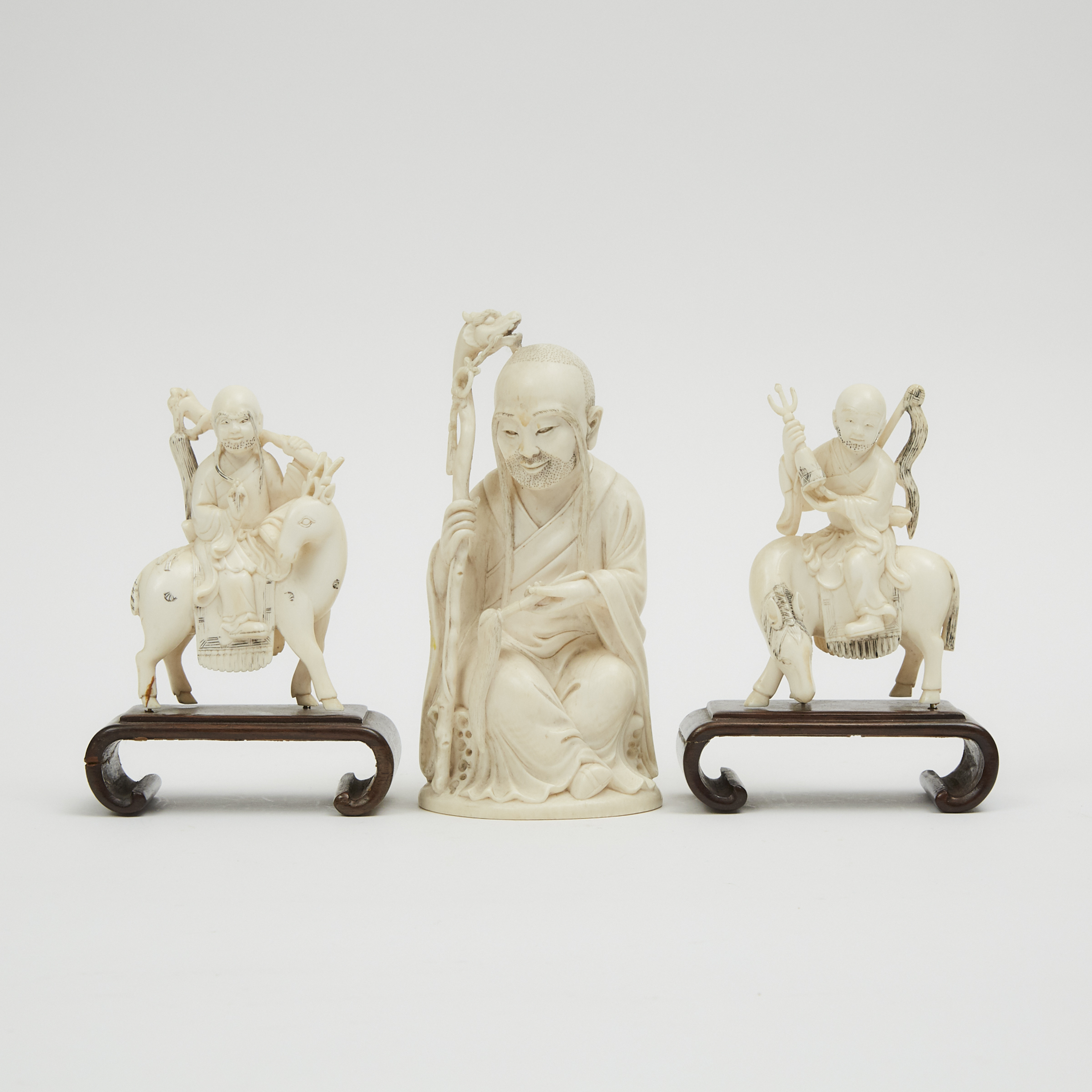 A Group of Three Chinese Ivory Carved 'Luohan' Figures, Early 20th Century