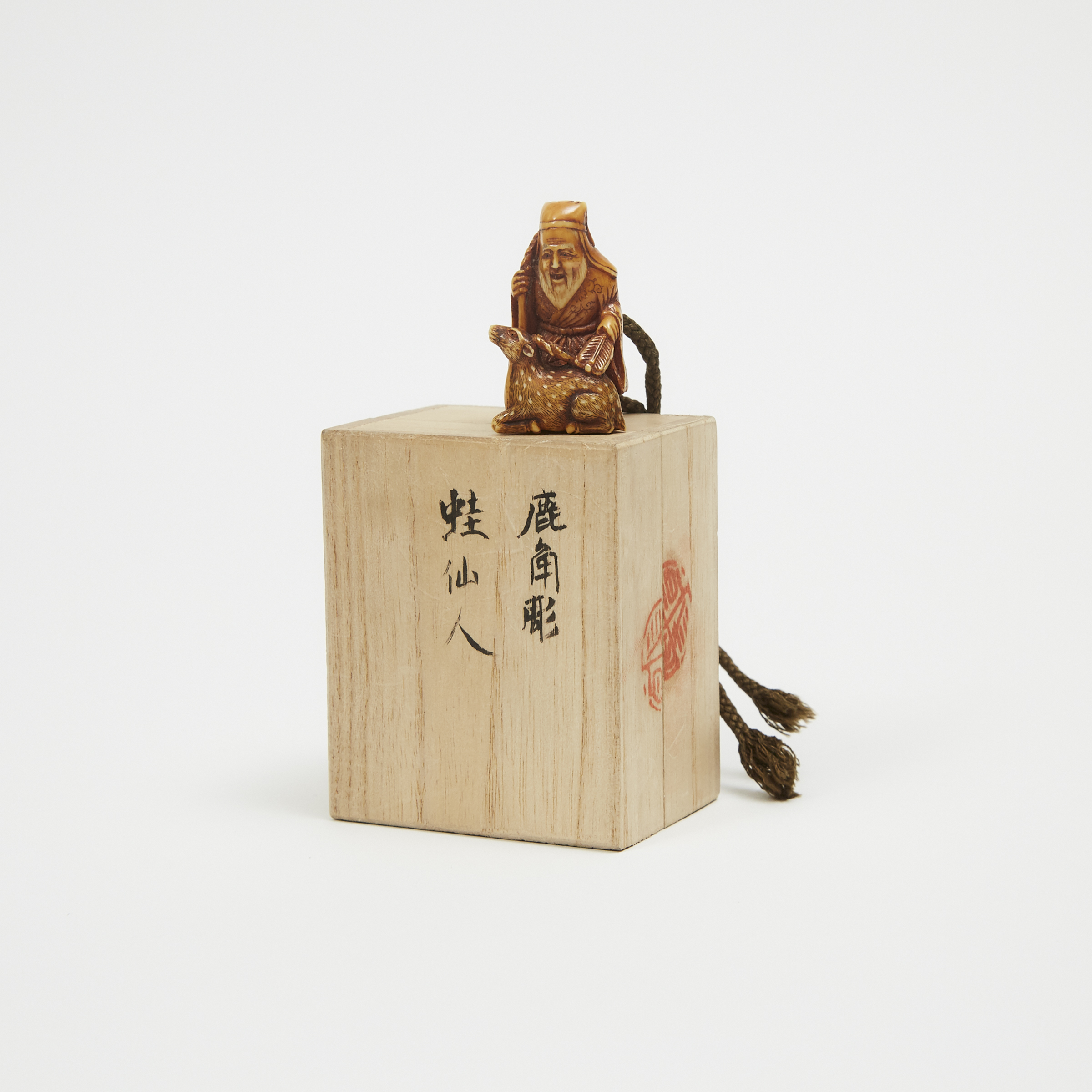 An Ivory Netsuke of an Old Man and Deer, with Signed Box