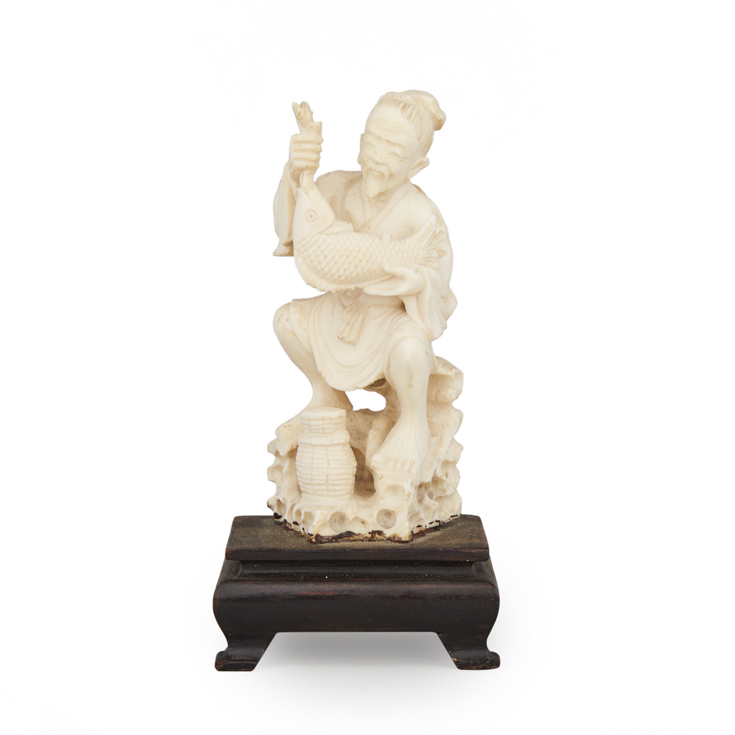 An Ivory Carved Fisherman