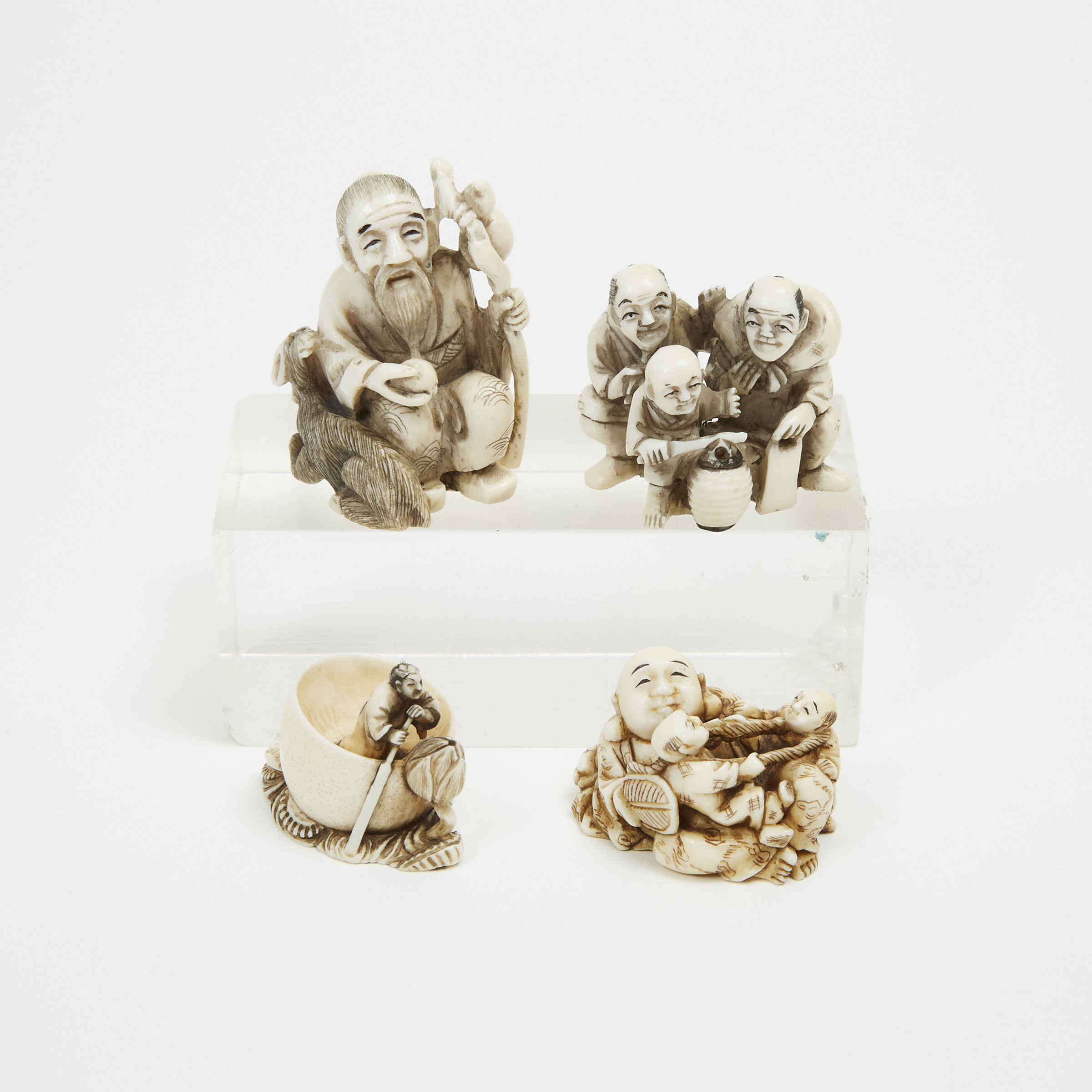 A Group of Four Ivory Carved Figural Netsuke, Signed