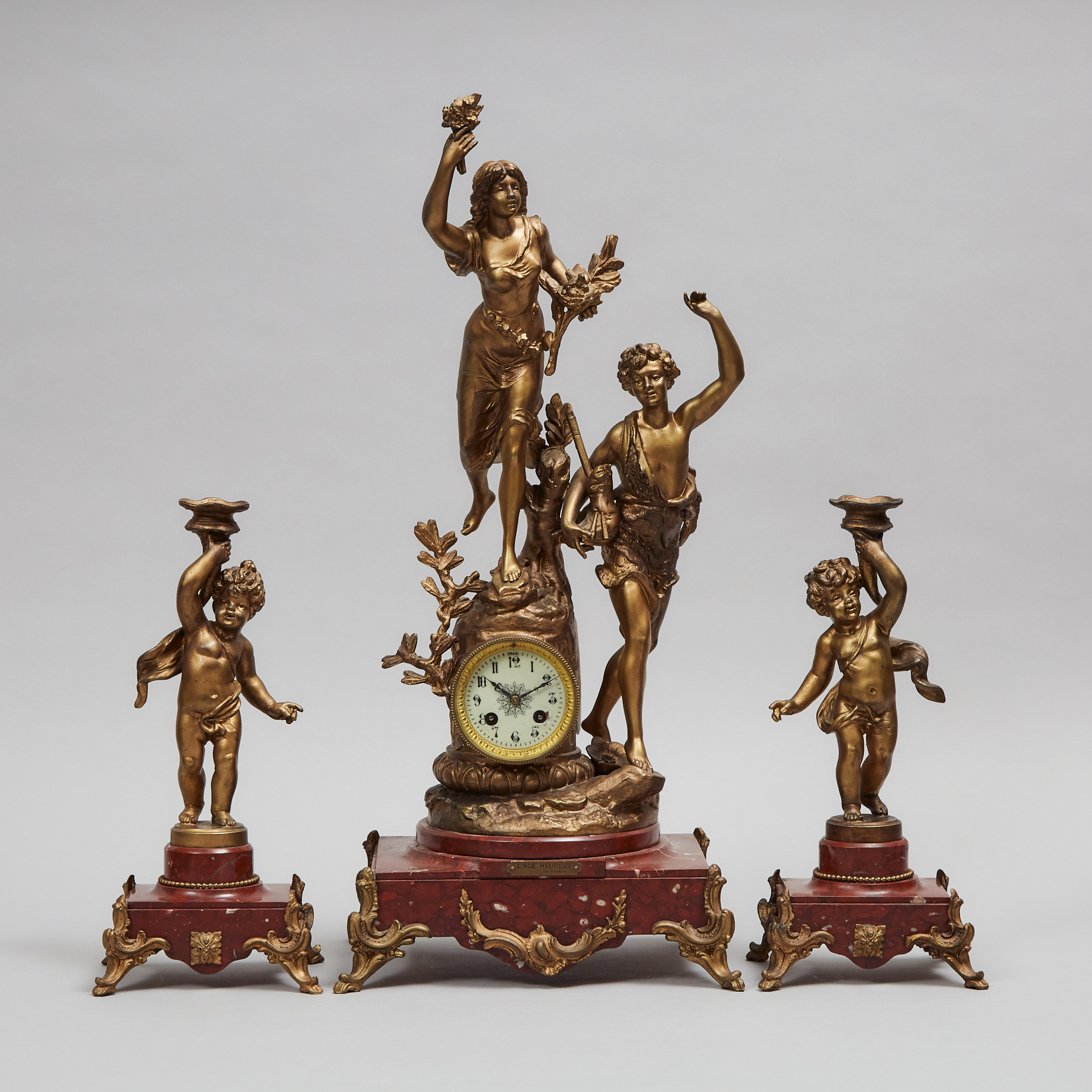 French Gilt Metal and Rouge Griotte Marble Three Piece Clock Garniture, c.1900