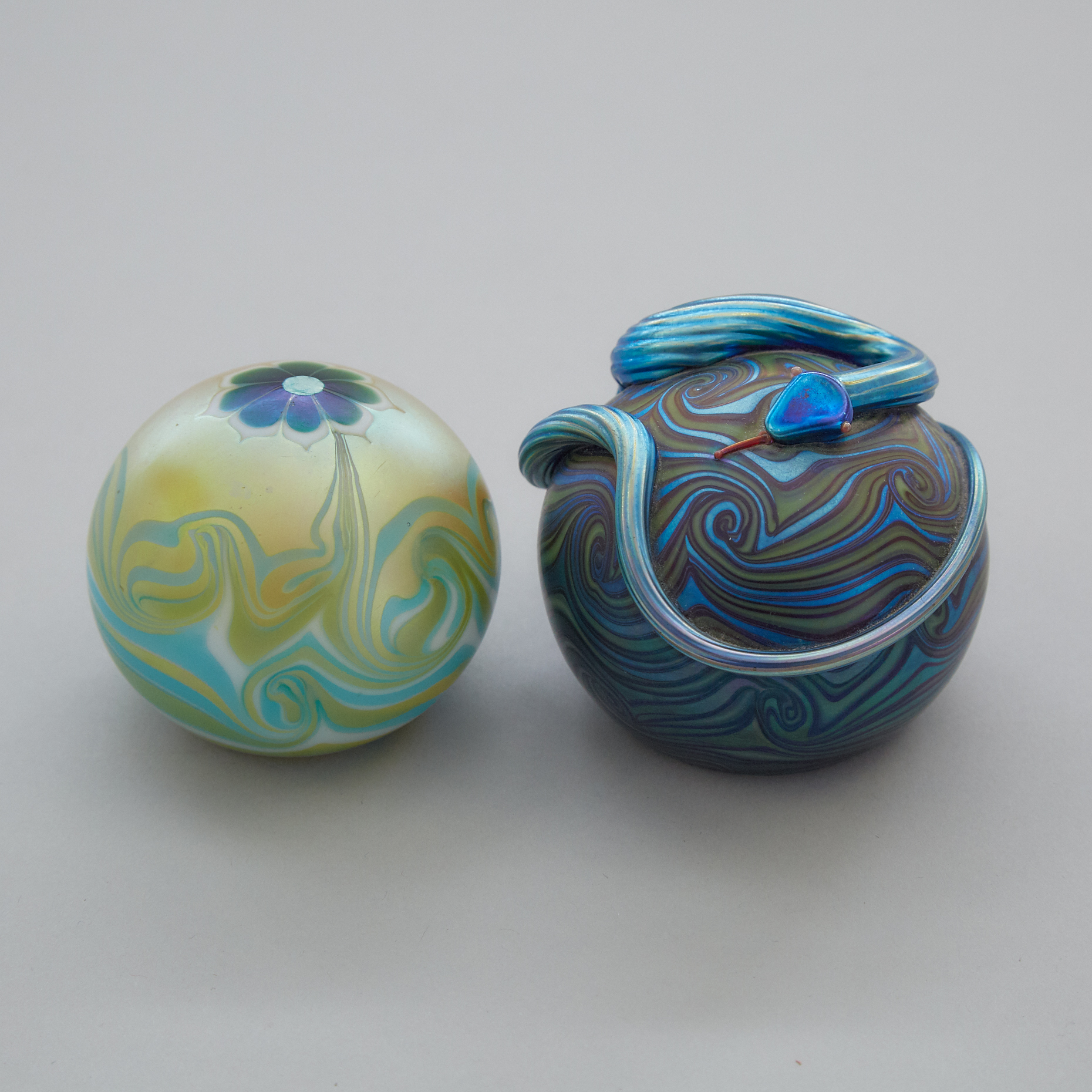 Two American Iridescent Glass Paperweights, Orient & Flume and Lundberg Studios, 1976/77