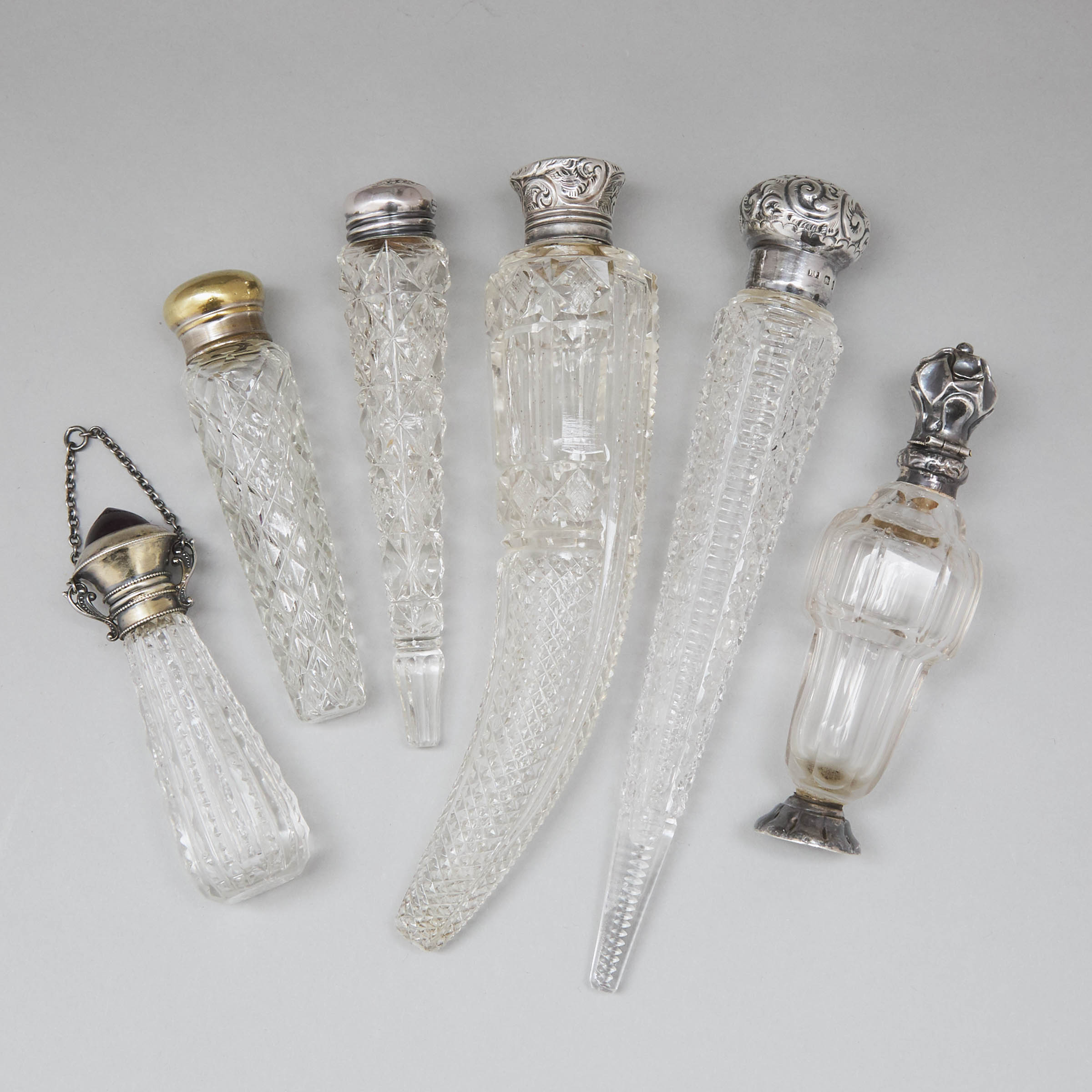 Six Silver and Metal Mounted Cut Glass Perfume Bottles and Phials, late 19th/early 20th century