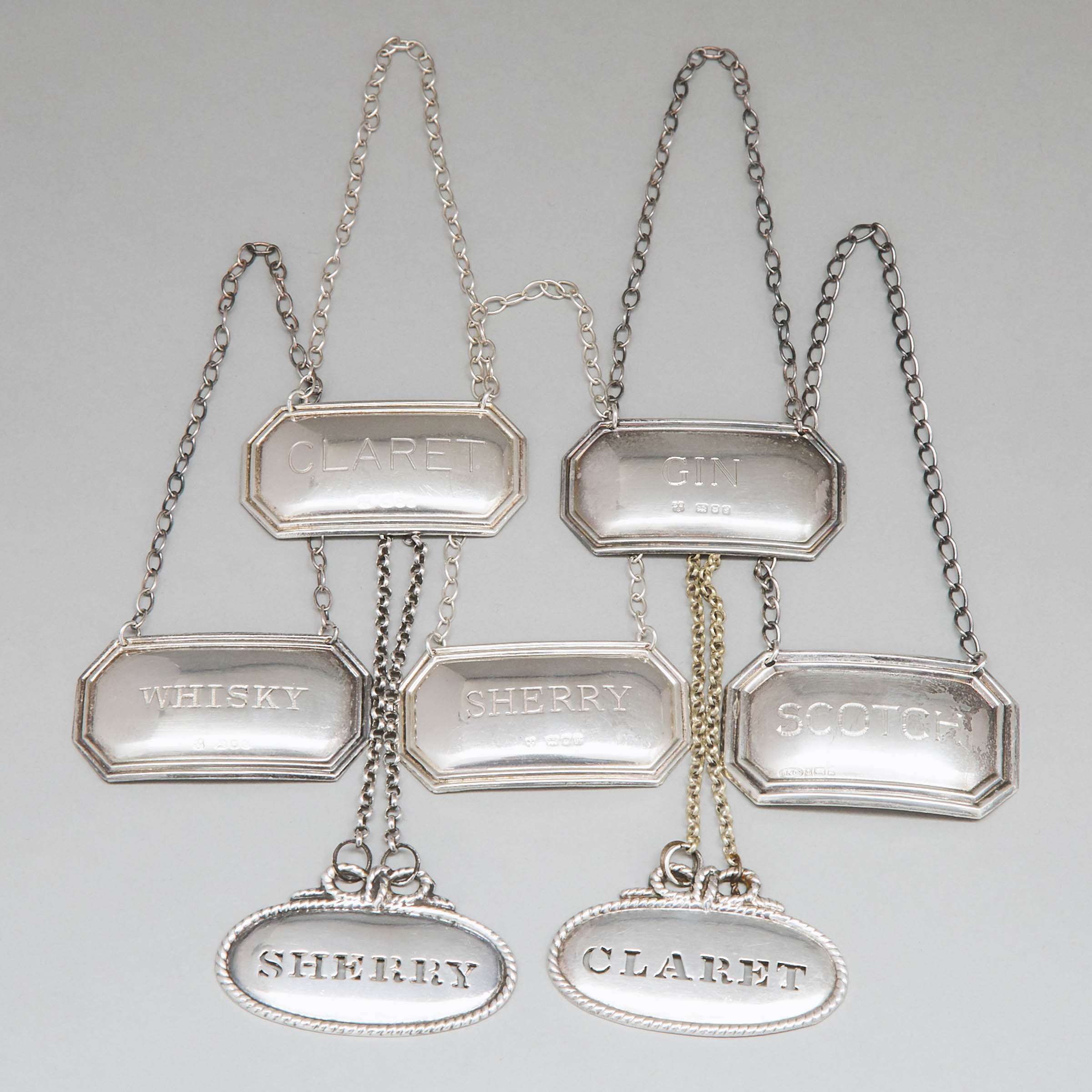 Seven Mainly English Silver Wine Labels, 20th century