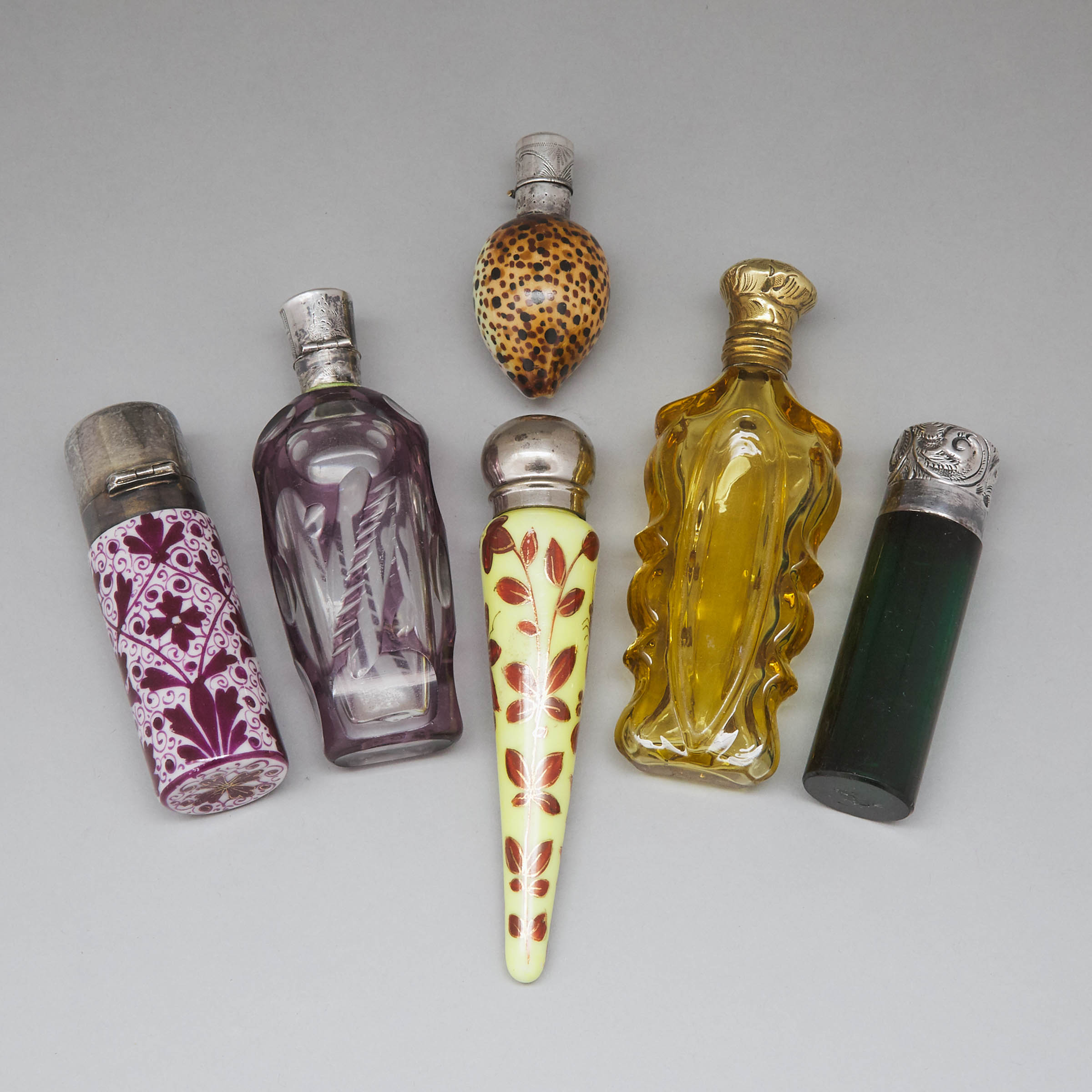Six Silver and Metal Mounted Coloured, Cut and Enameled Glass Perfume Bottles and Phials, late 19th/early 20th century
