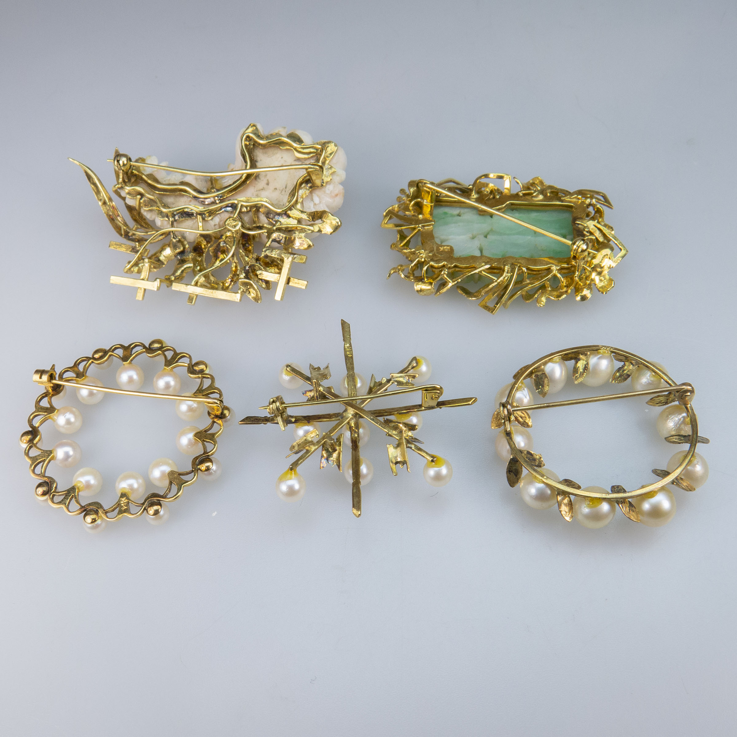 Five Gold Brooches