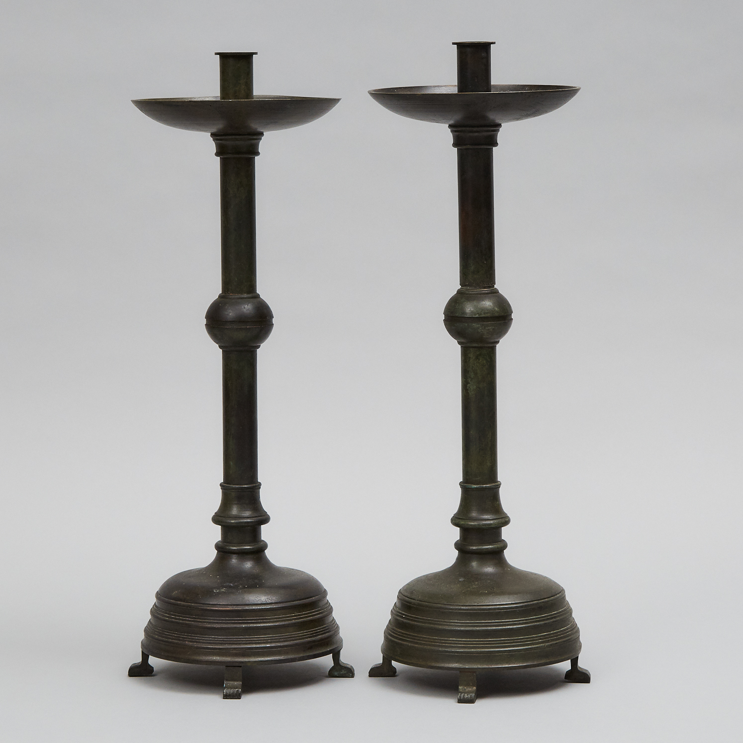 Pair of Tall Patinated Bronze Candlesticks, early 20th century
