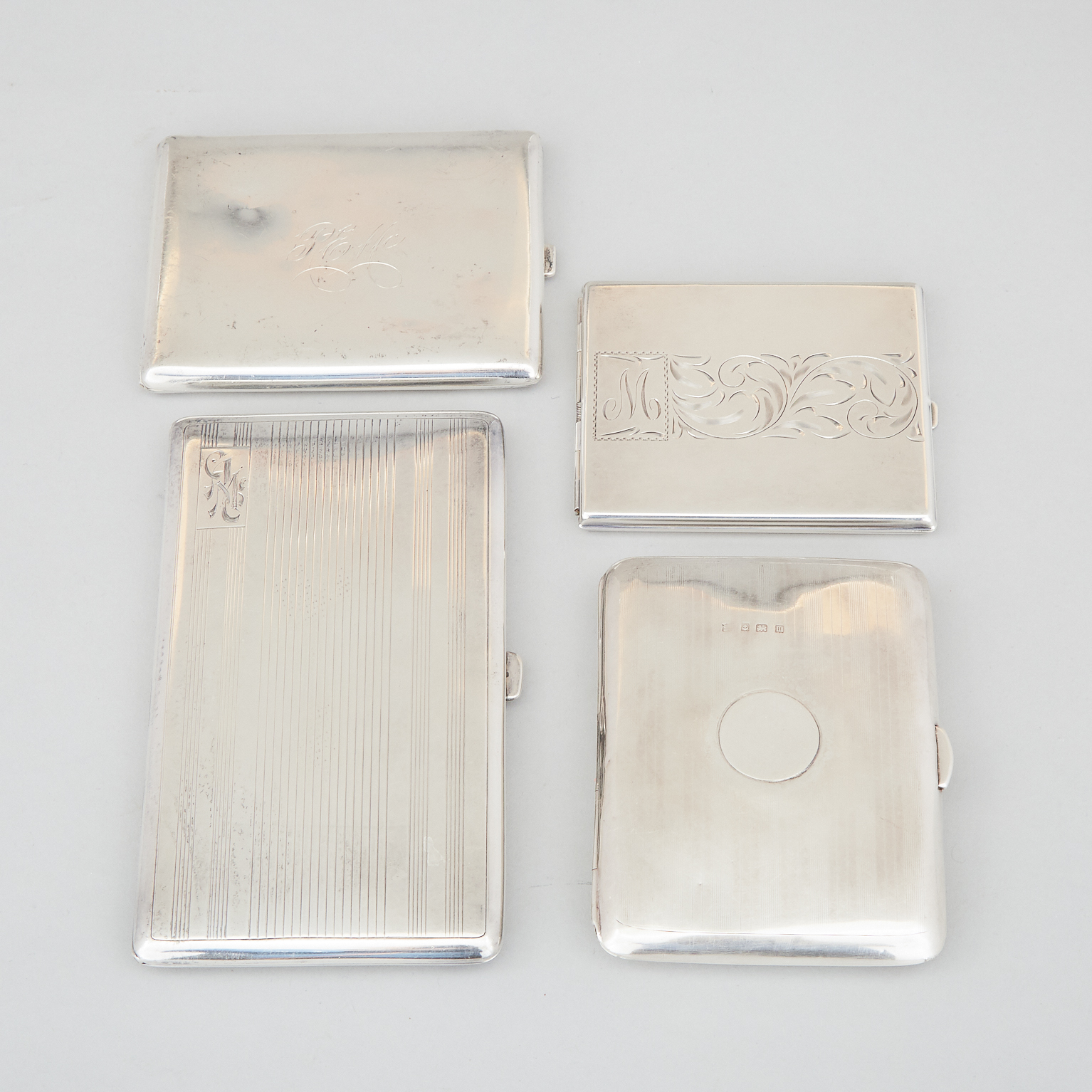 Four English and Canadian Silver Rectangular Cigarette Cases, 20th century