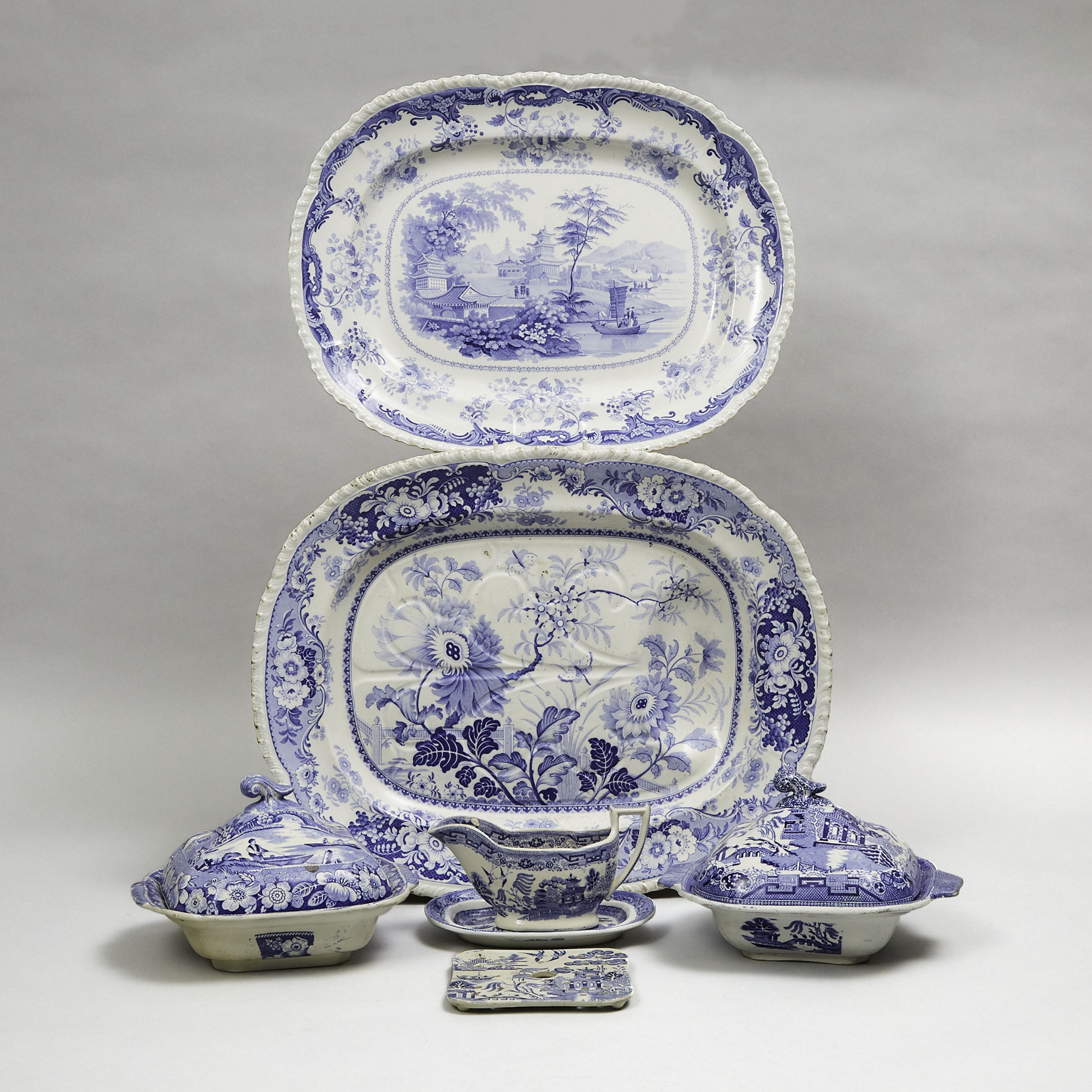 Two Staffordshire Blue-Printed  Oval Platters, Two Covered Dishes, Mazarine, Sauce Boat and a Small Platter, 19th century