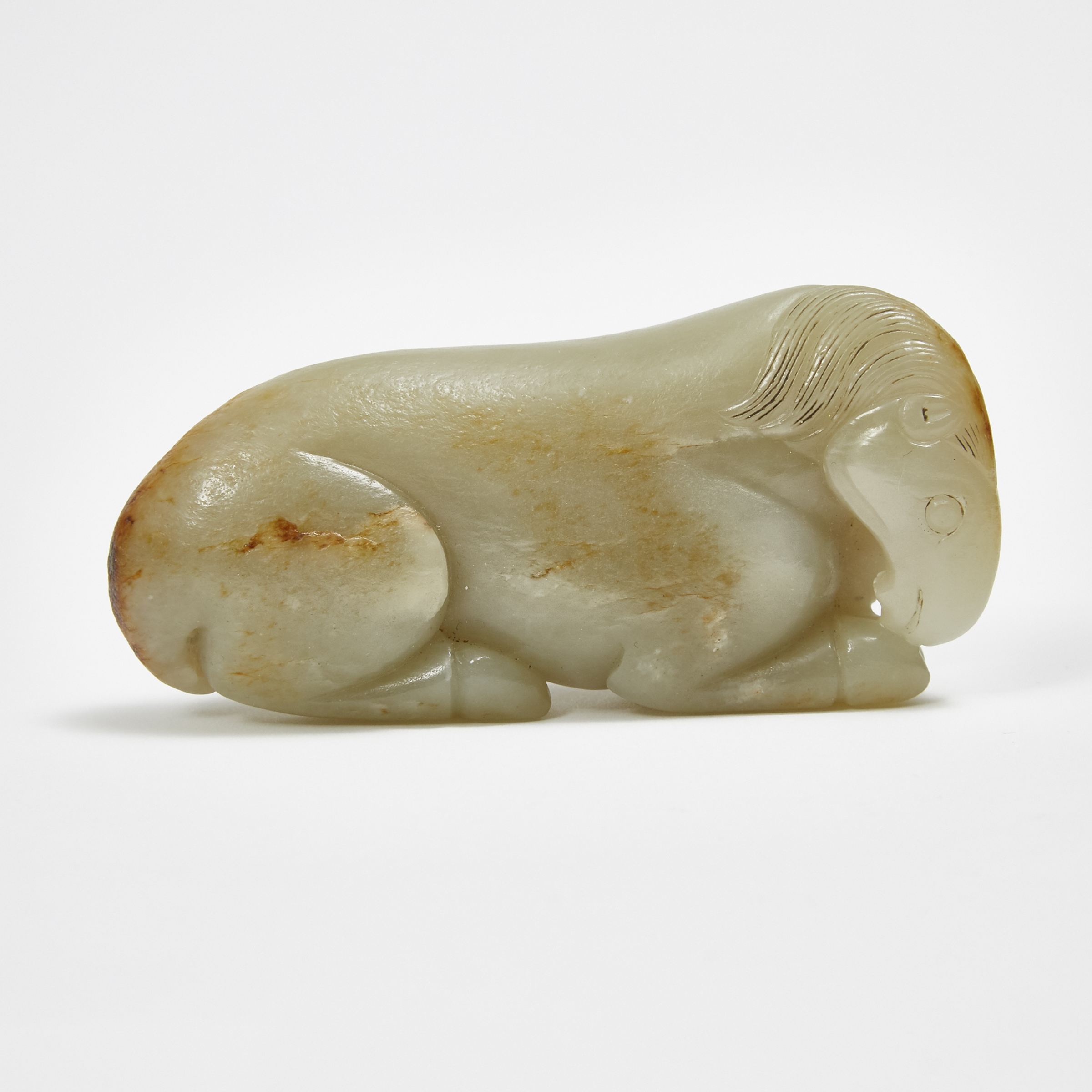 A Greyish-White and Russet Jade Carving of a Horse