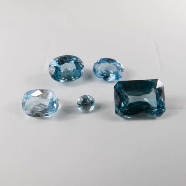 9 Various Cut Blue And Gold Zircons