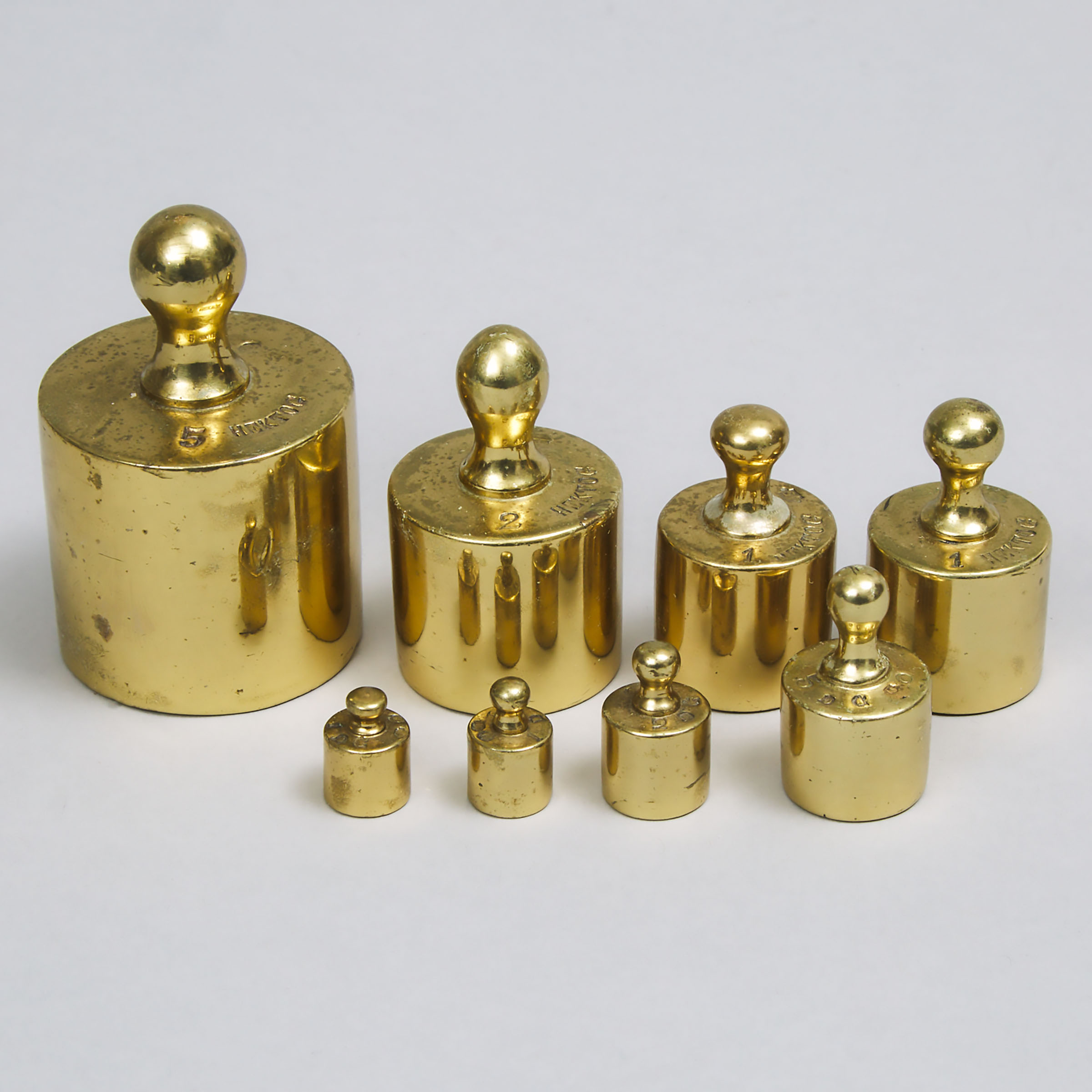 Set of Eight Turned Brass Graduated Weights, 19th century