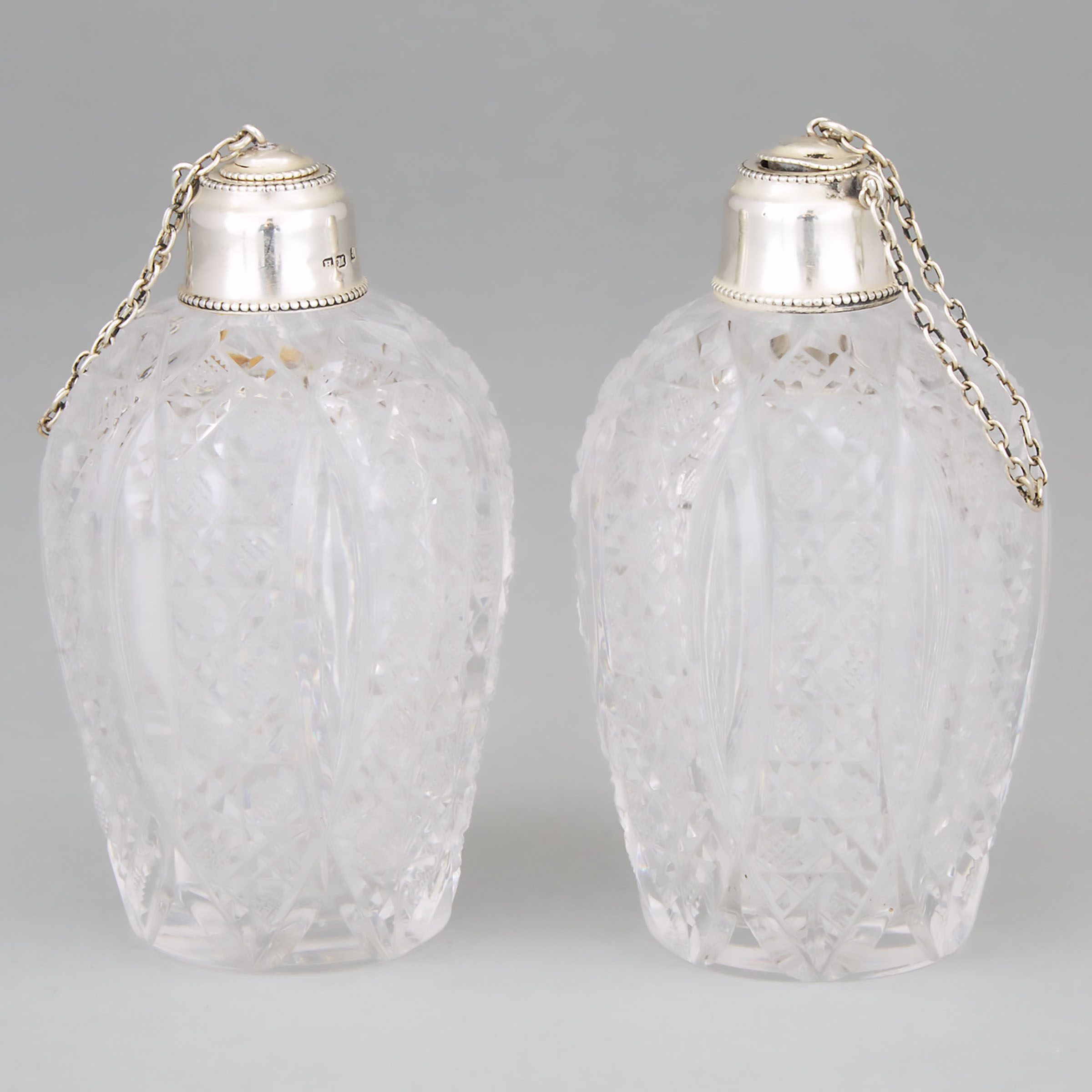 Pair of Late Victorian Silver Mounted Cut Glass Perfume Bottles, Henry Matthews, Birmingham, 1900