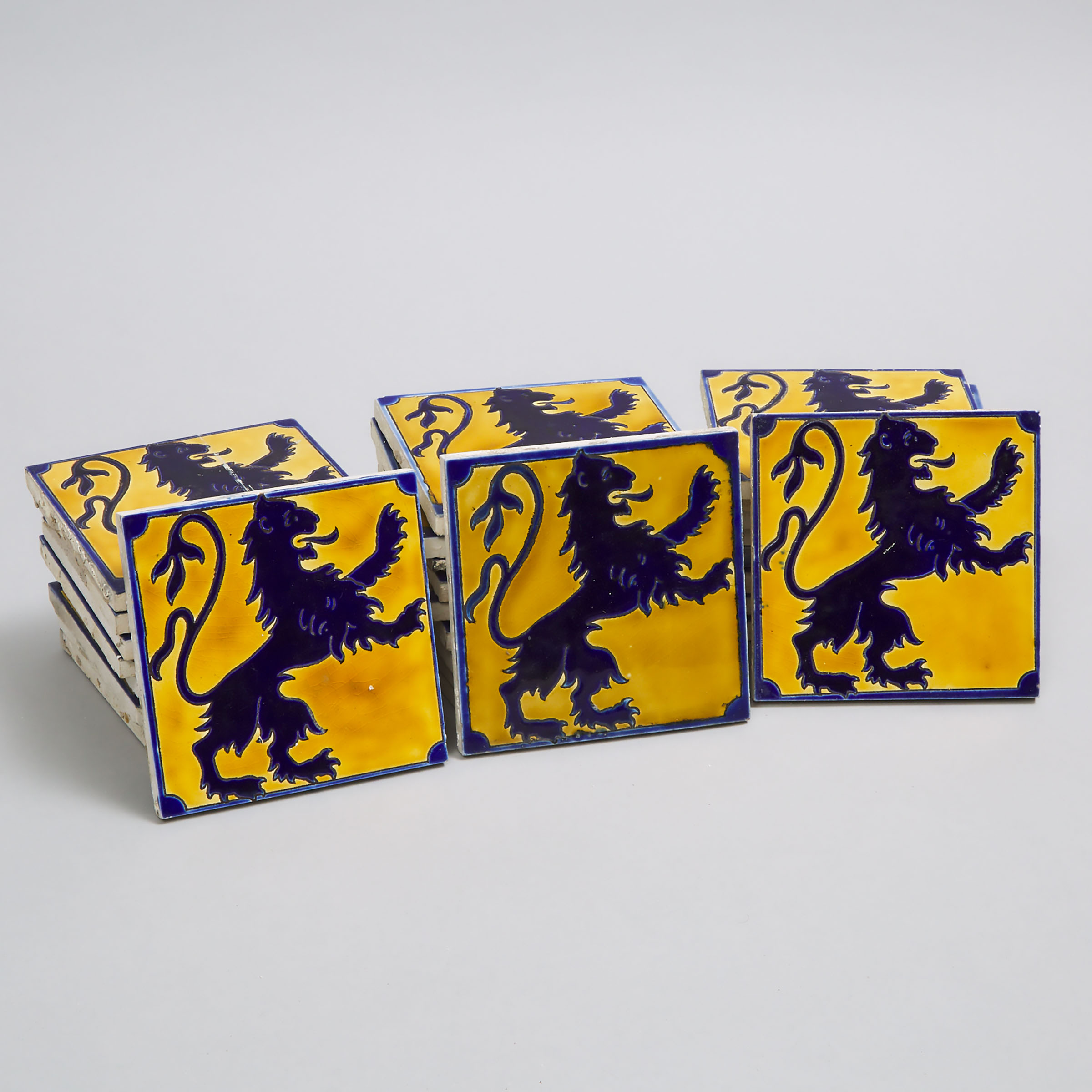 Twenty-Eight Boch Frères Blue and Yellow Glazed Heraldic Rampant Lion Tiles, 20th century