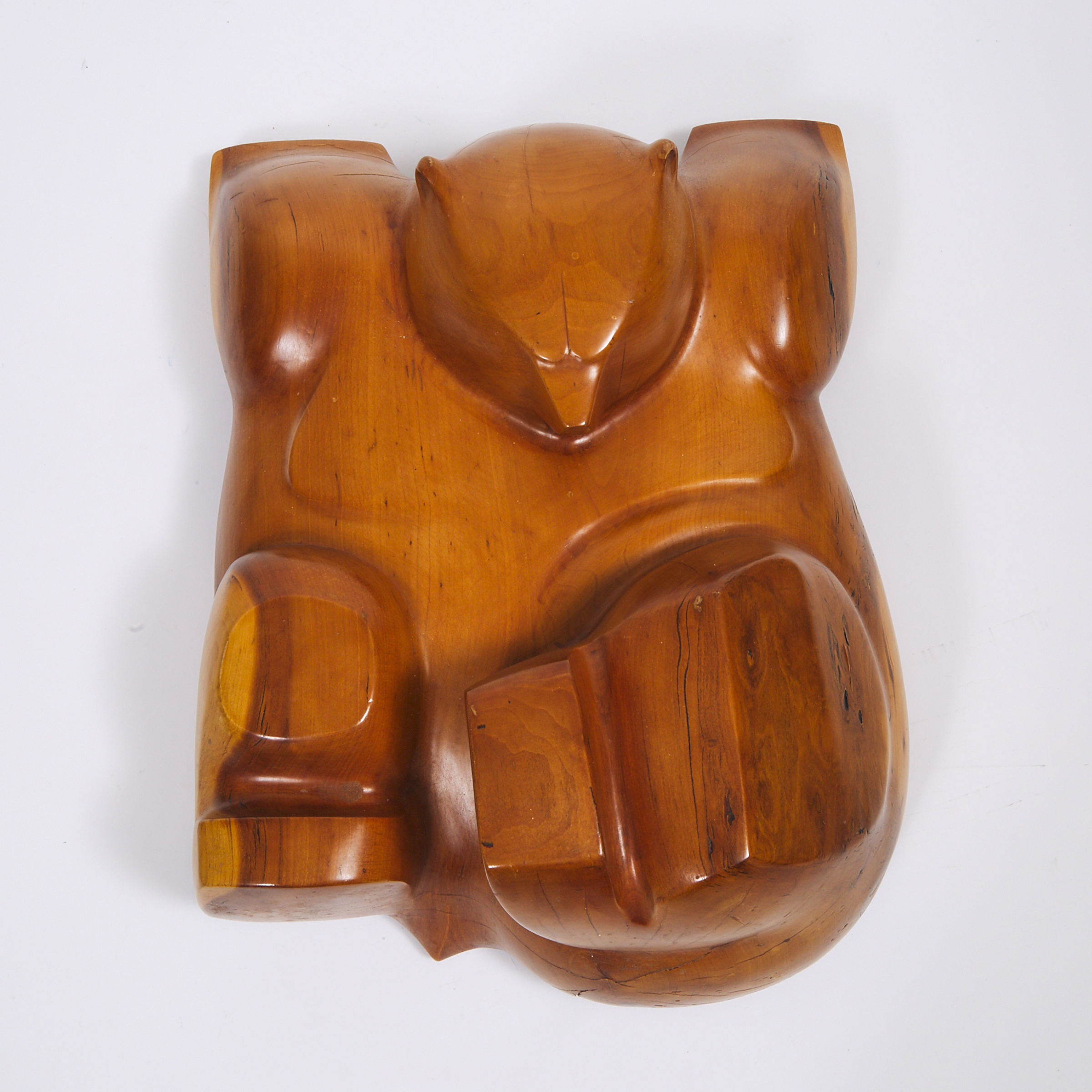 Canadian School Carved Walnut Model of a Sleeping Bear, late 20th century