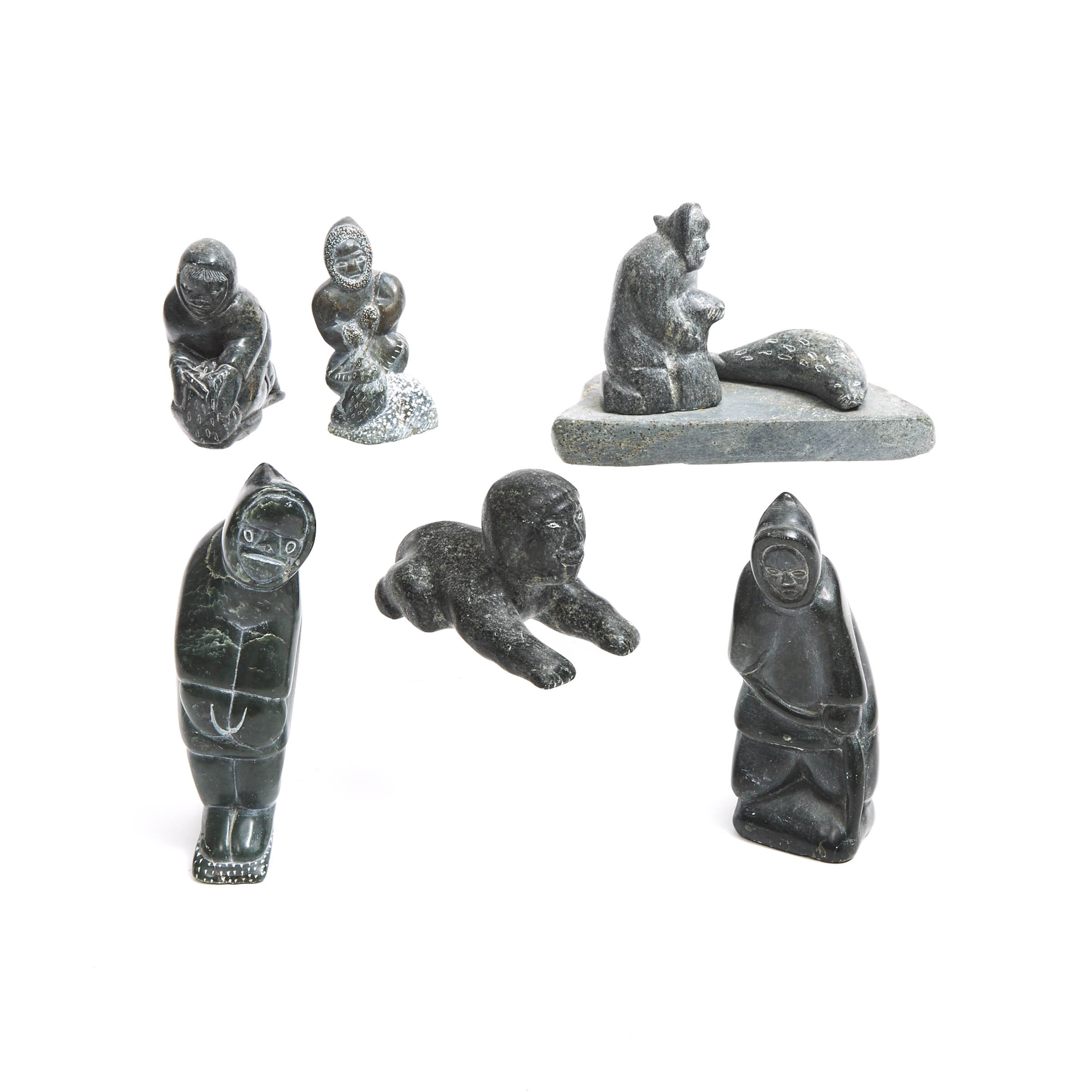 A COLLECTION OF SIX INUIT CARVINGS OF HUNTING SCENES