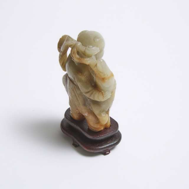 A Mottled Celadon and Russet Stone 'Boy and Deer' Group, Qing Dynasty