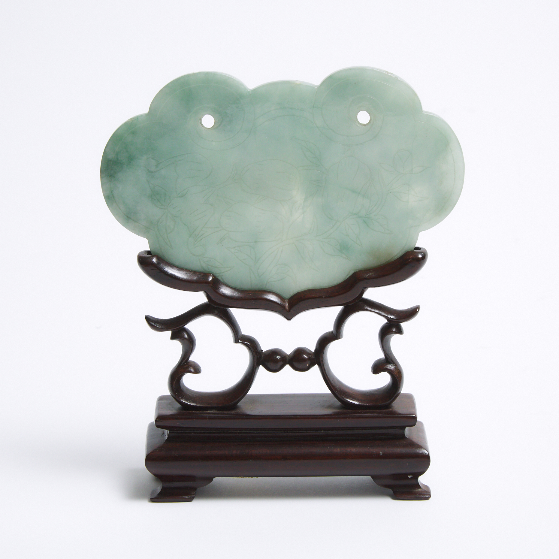 A Jadeite Ruyi Head Lock-Form Plaque with Stand, Qing Dynasty