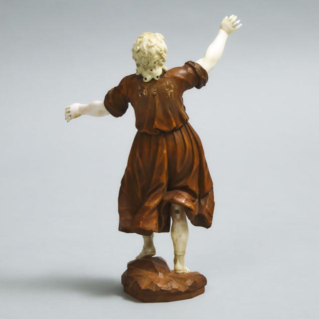 South German Walnut and ivory Figure of an Angel,  Workshop of Simon Troger (1683-1768) first half, 18th century