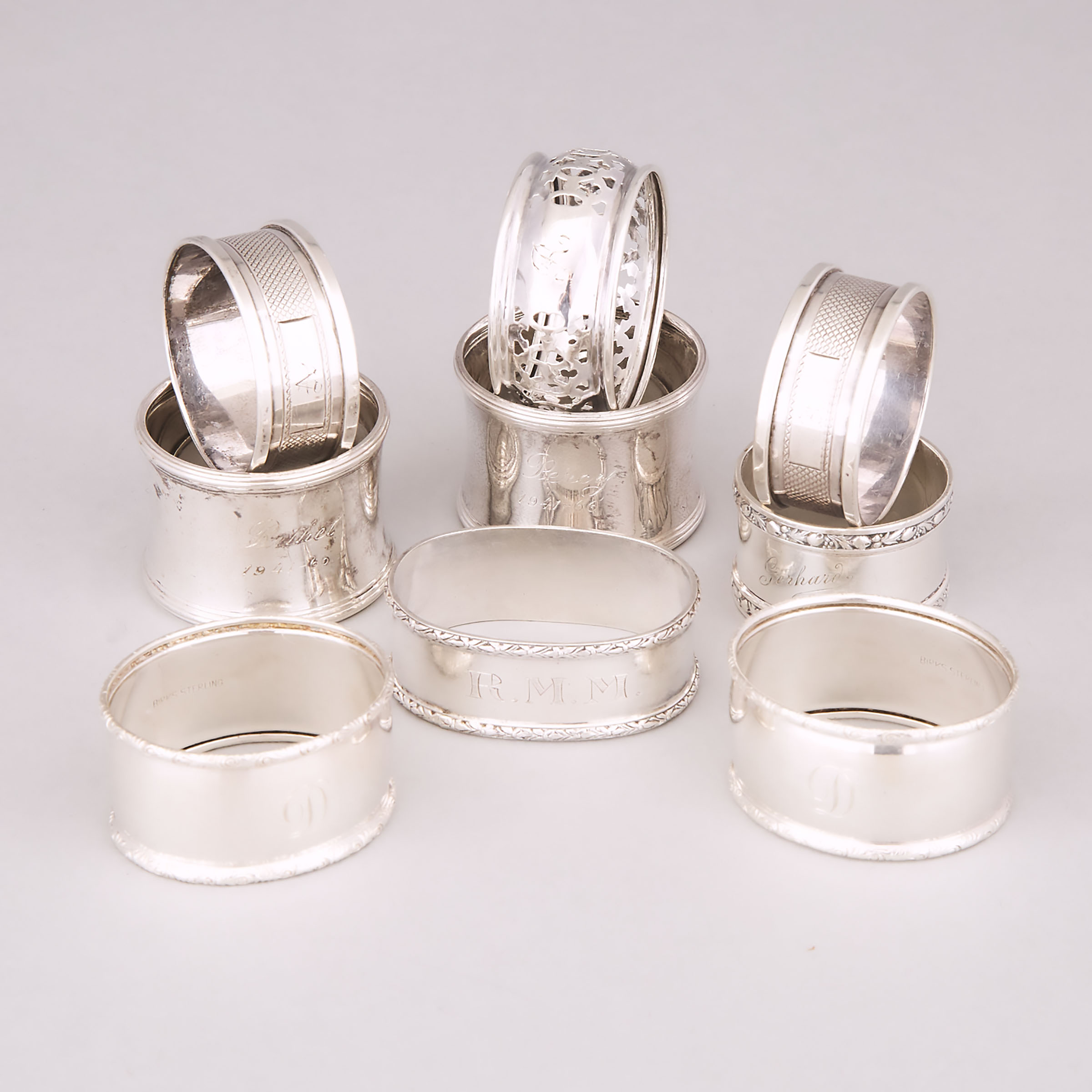 Group of Nine Canadian, English, and German Silver Napkin Rings, 20th century
