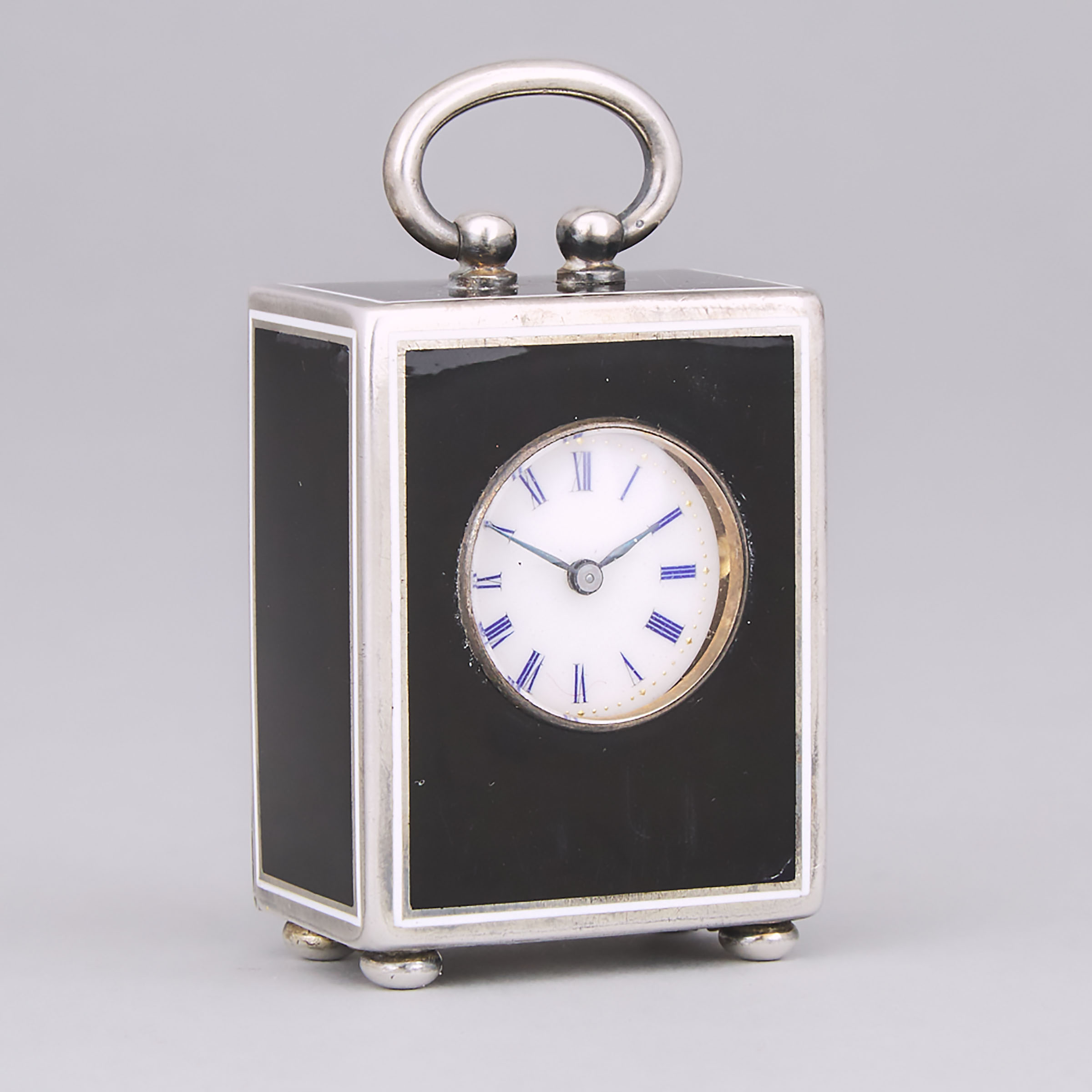 Continental Black and White Enameled and Engraved Silver Cased Miniature Desk Clock, probably Swiss, early 20th century