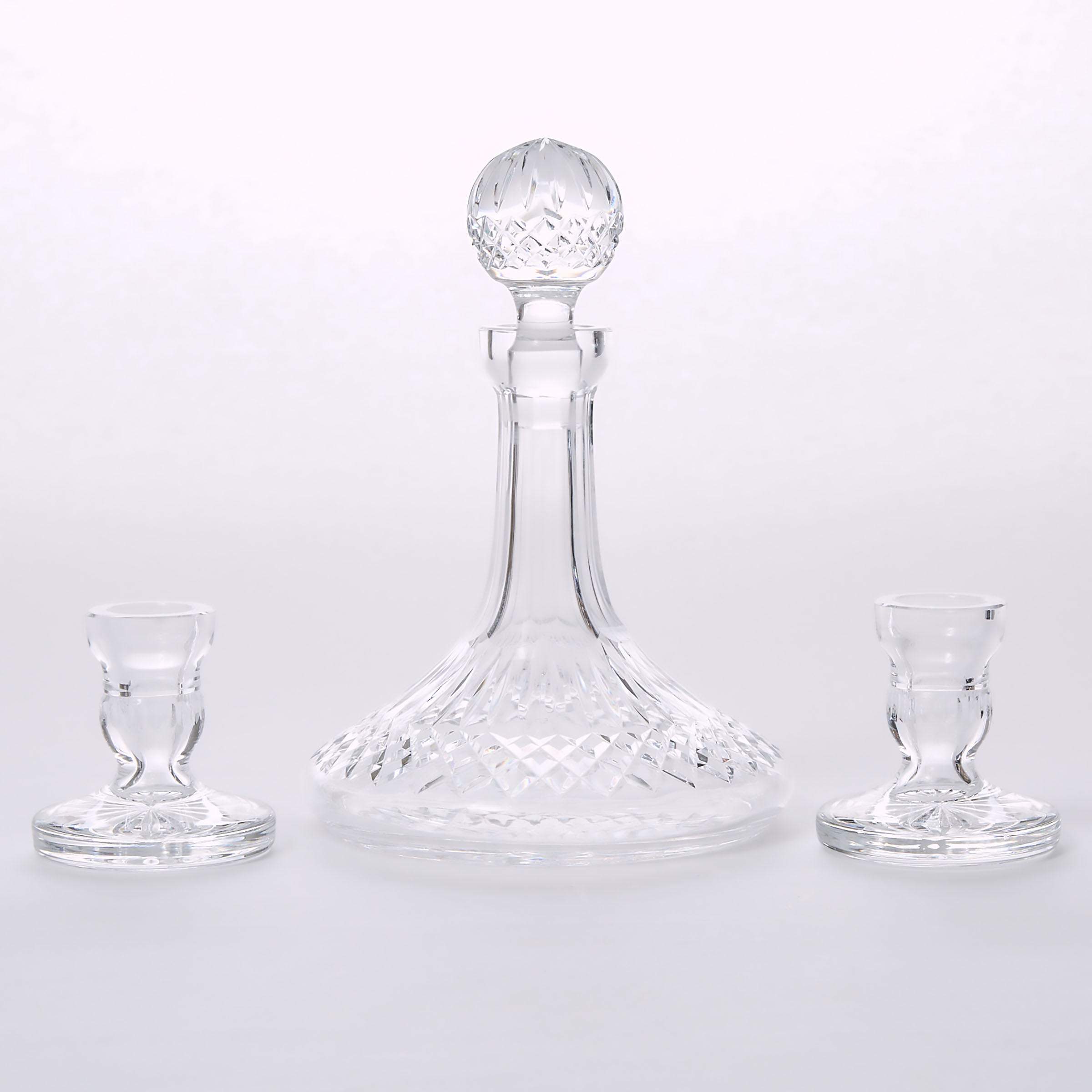 Waterford Cut Glass 'Lismore' Pattern Ship's Decanter and Two Low Candlesticks, 20th century