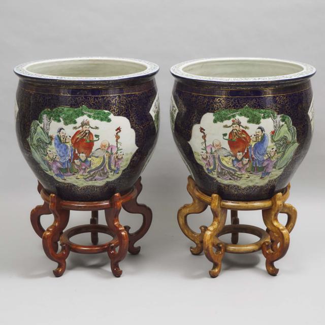 A Pair of Chinese Famille Rose Blue-Ground Fish Bowls on Stands, 20th Century