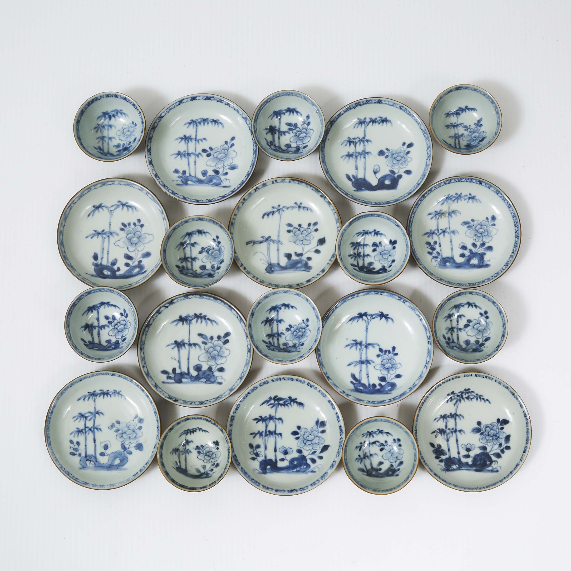 A Set of Twenty 'Batavian Bamboo and Peony' Pattern Teabowls and Saucers from the Nanking Cargo, Qianlong Period, Circa 1750