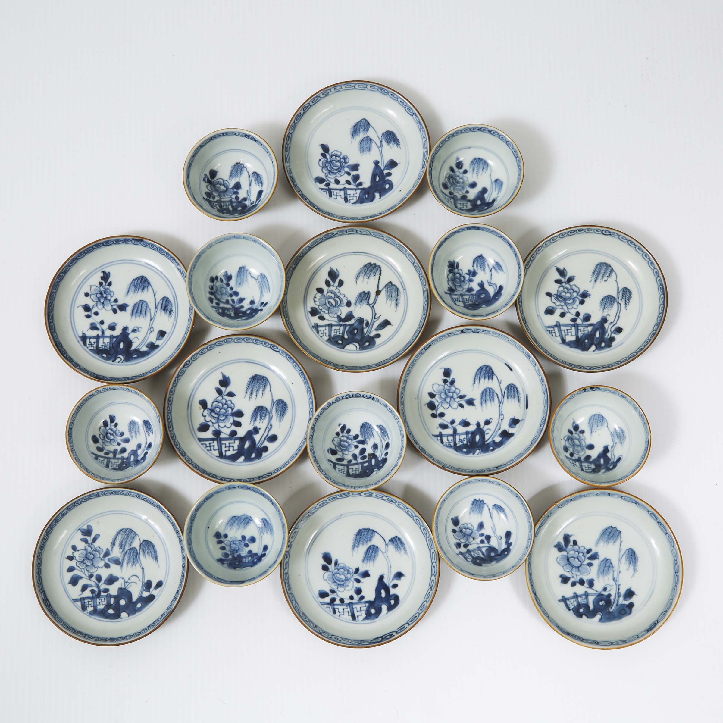 A Set of Eighteen 'Batavian Willow' Pattern Teabowls and Saucers from the Nanking Cargo, Qianlong Period, Circa 1750